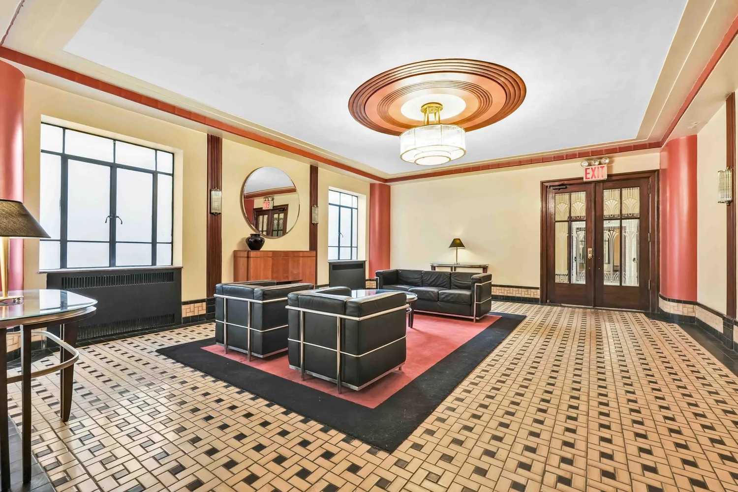 a living room with furniture a rug and a large window