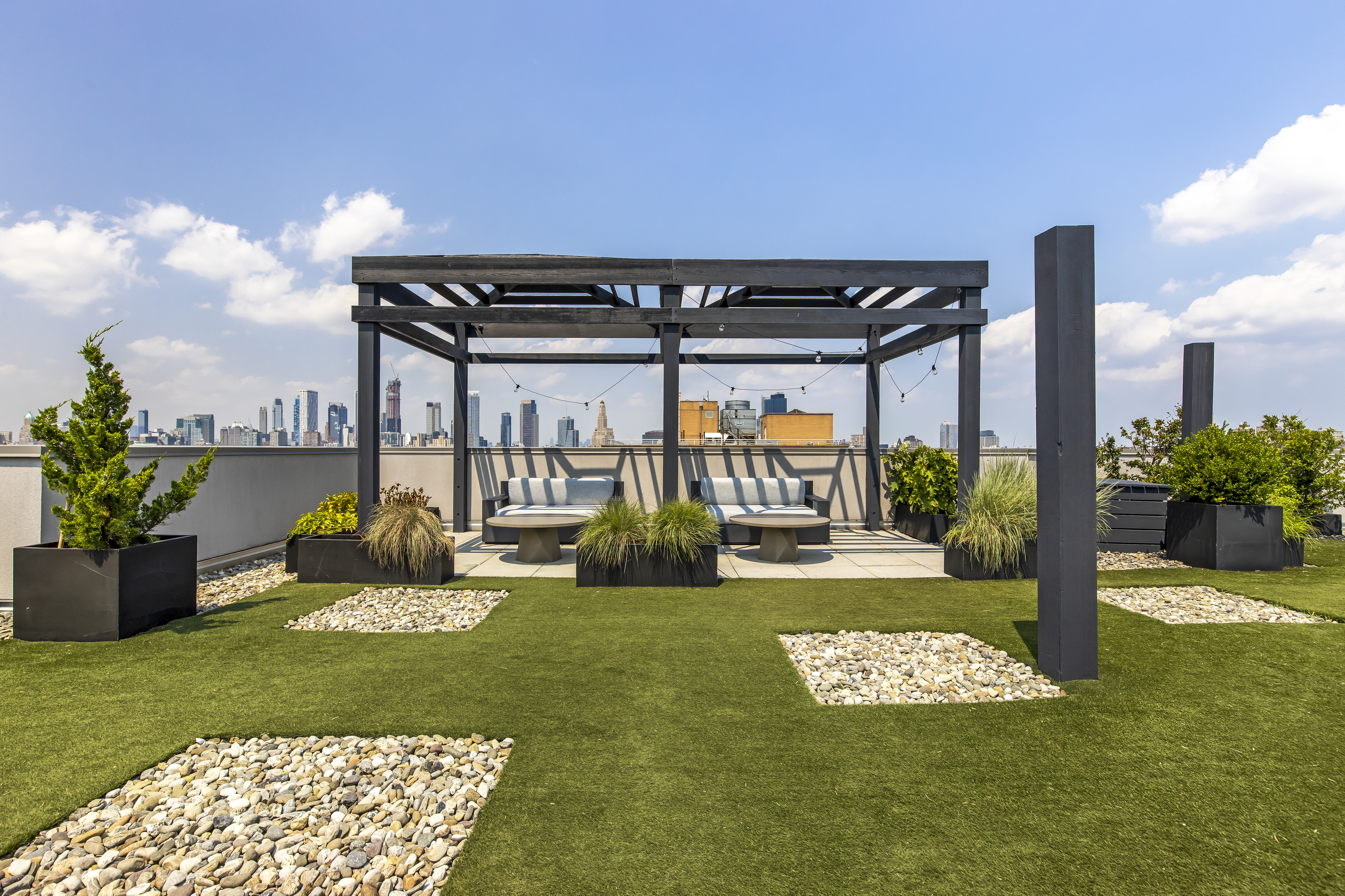 267 6th Street, Unit 2H Brooklyn, NY 11215 - Photo 7 of 14 a view of a patio with table and chairs potted plants with wooden floor and fence