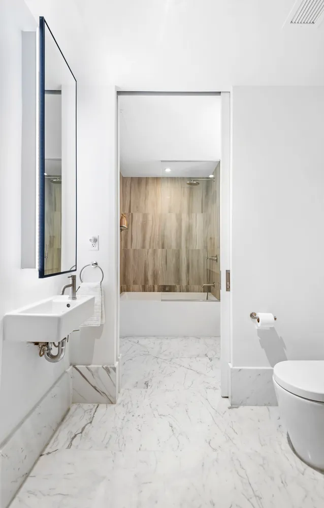 a bathroom with a bathtub and a sink