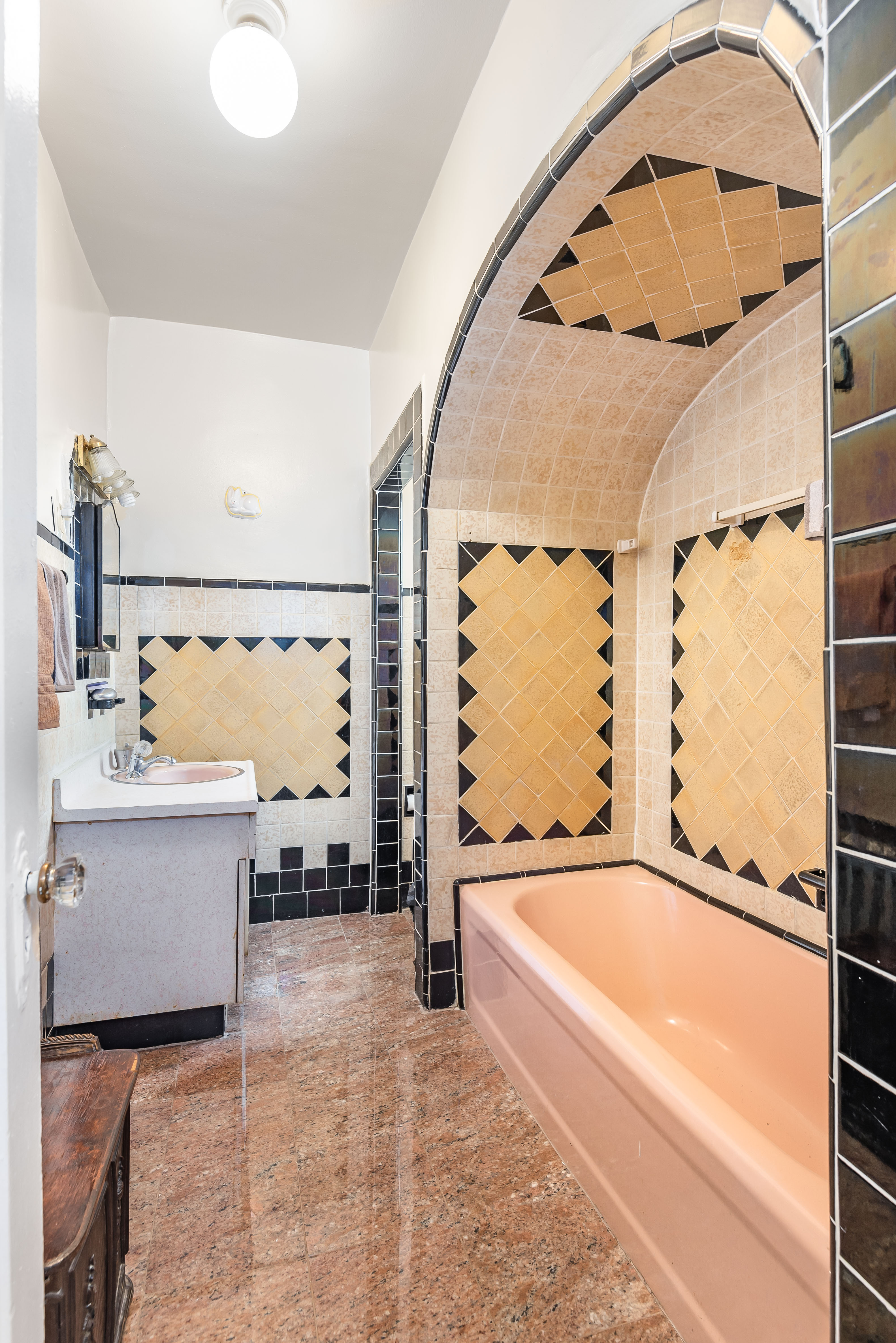 15 Lloyd Street Brooklyn, NY 11226 - Photo 13 of 18 a bathroom with a bathtub and a sink