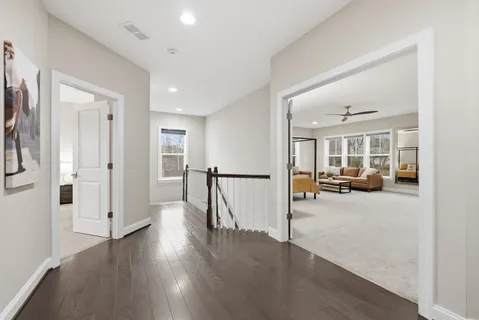 a view of a room with wooden floor