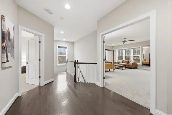 a bed room with furniture and a large window