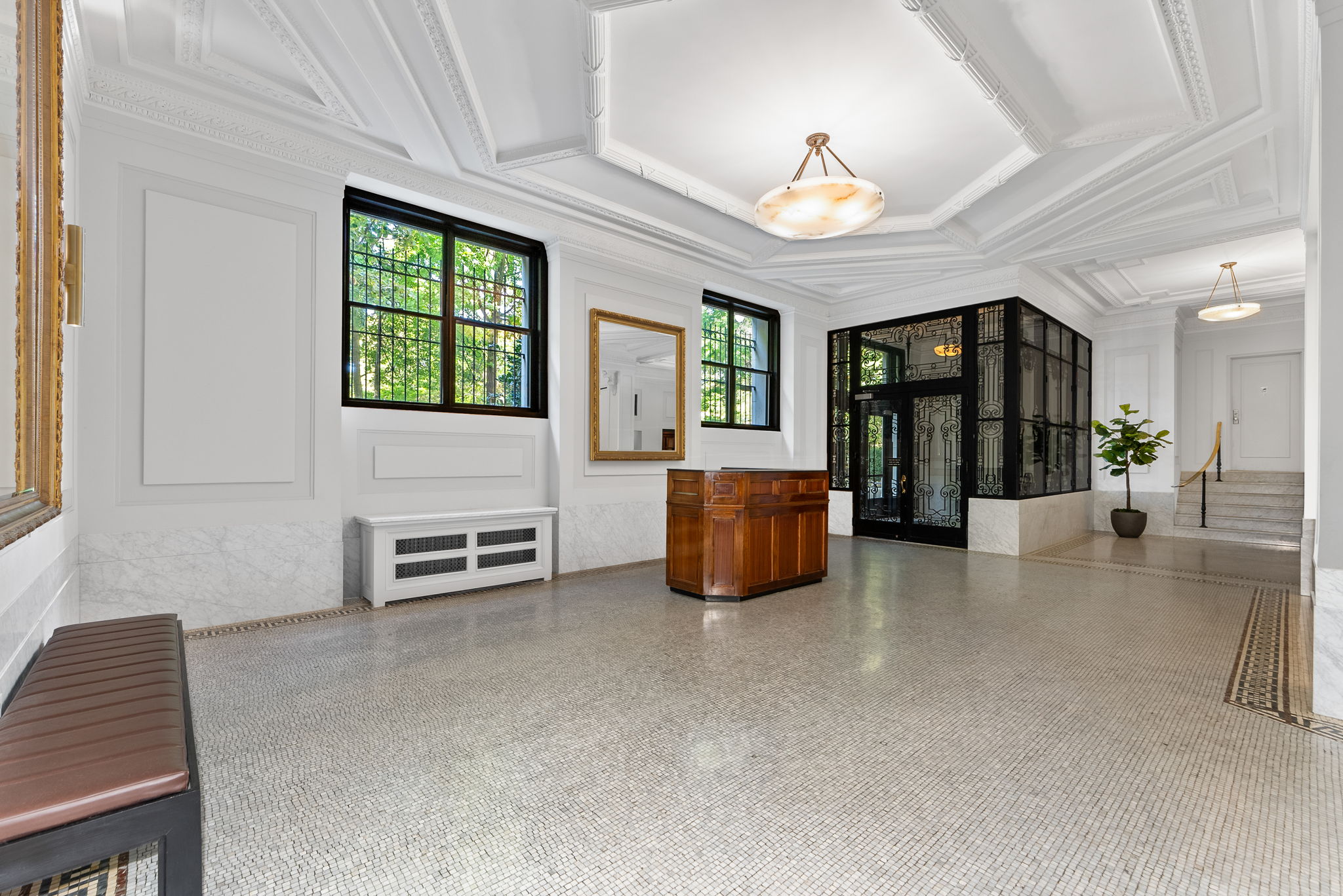 210 Riverside Drive, Unit 2E Manhattan, NY 10025 - Photo 12 of 15 a living room with furniture and a chandelier