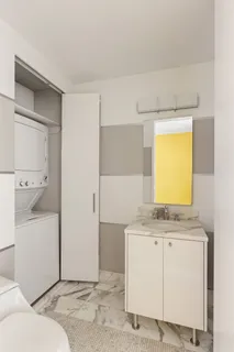 a bathroom with a sink a toilet and vanity