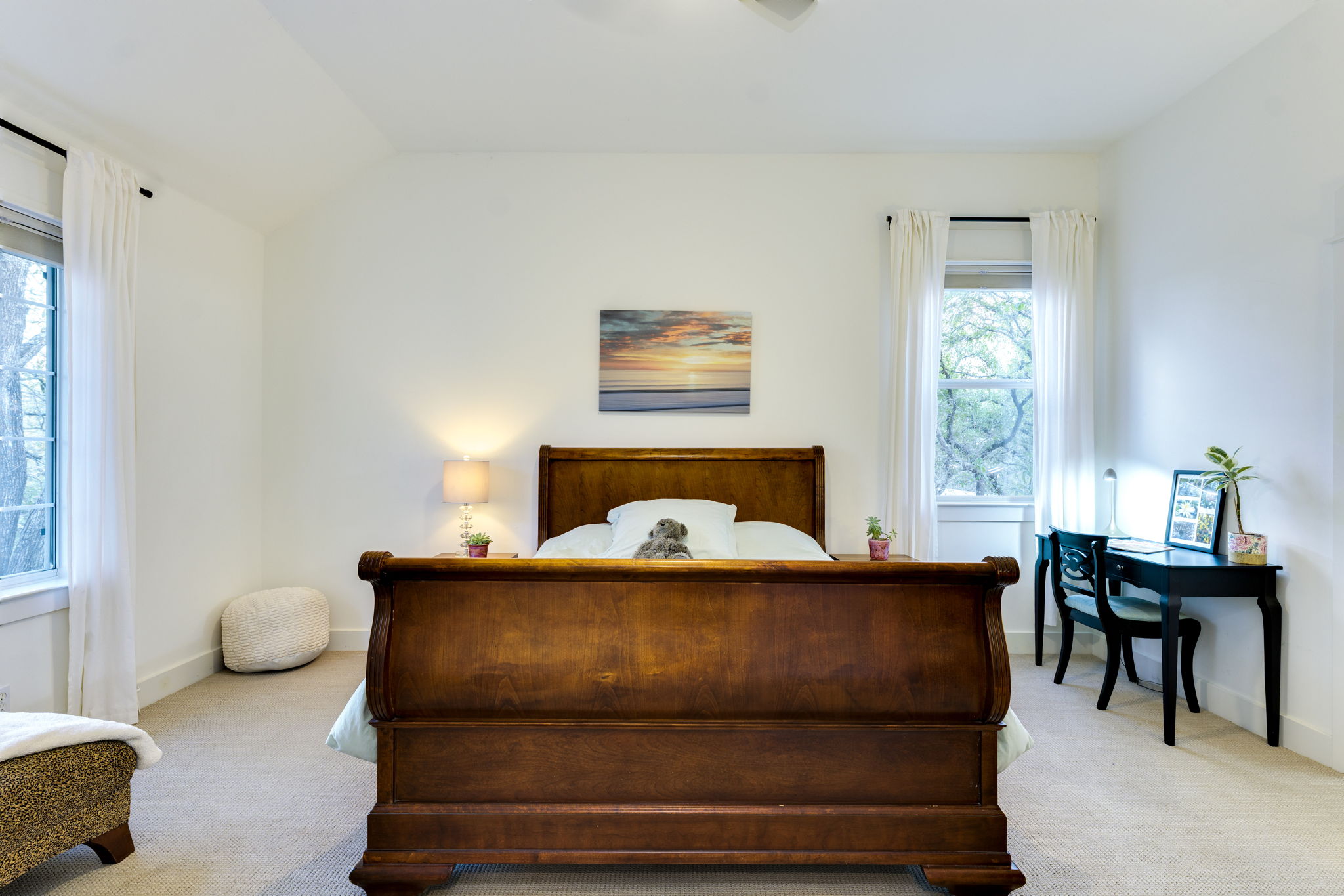 109 West Spring Drive Austin, TX 78746 - Photo 15 of 22 a bedroom with a bed and window