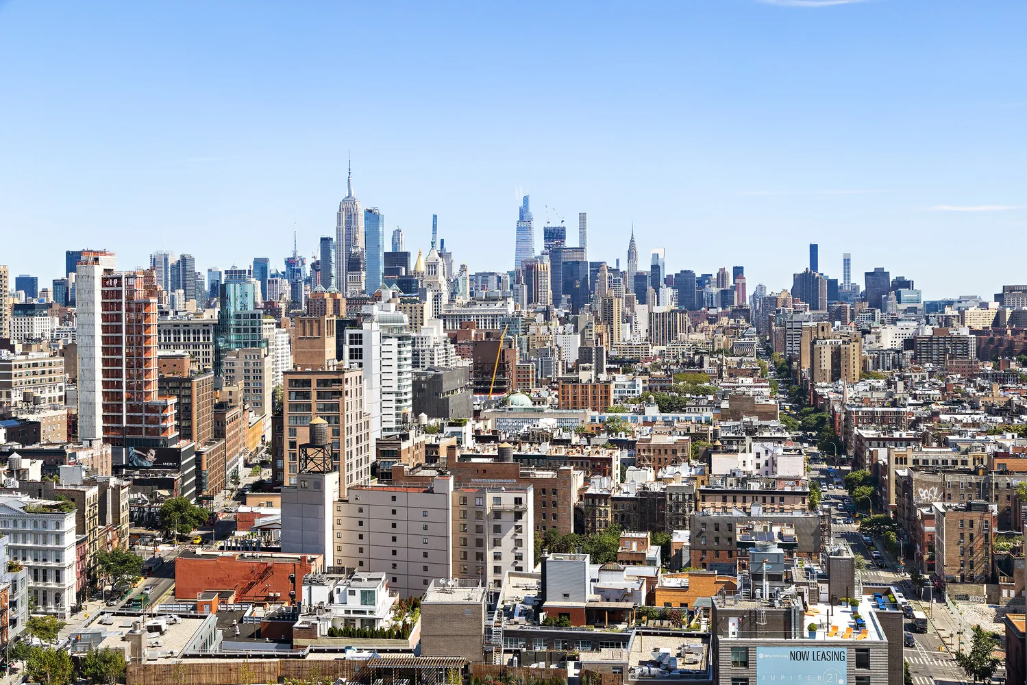 a view of a city with tall buildings