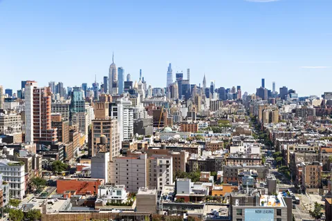 a view of a city with tall buildings