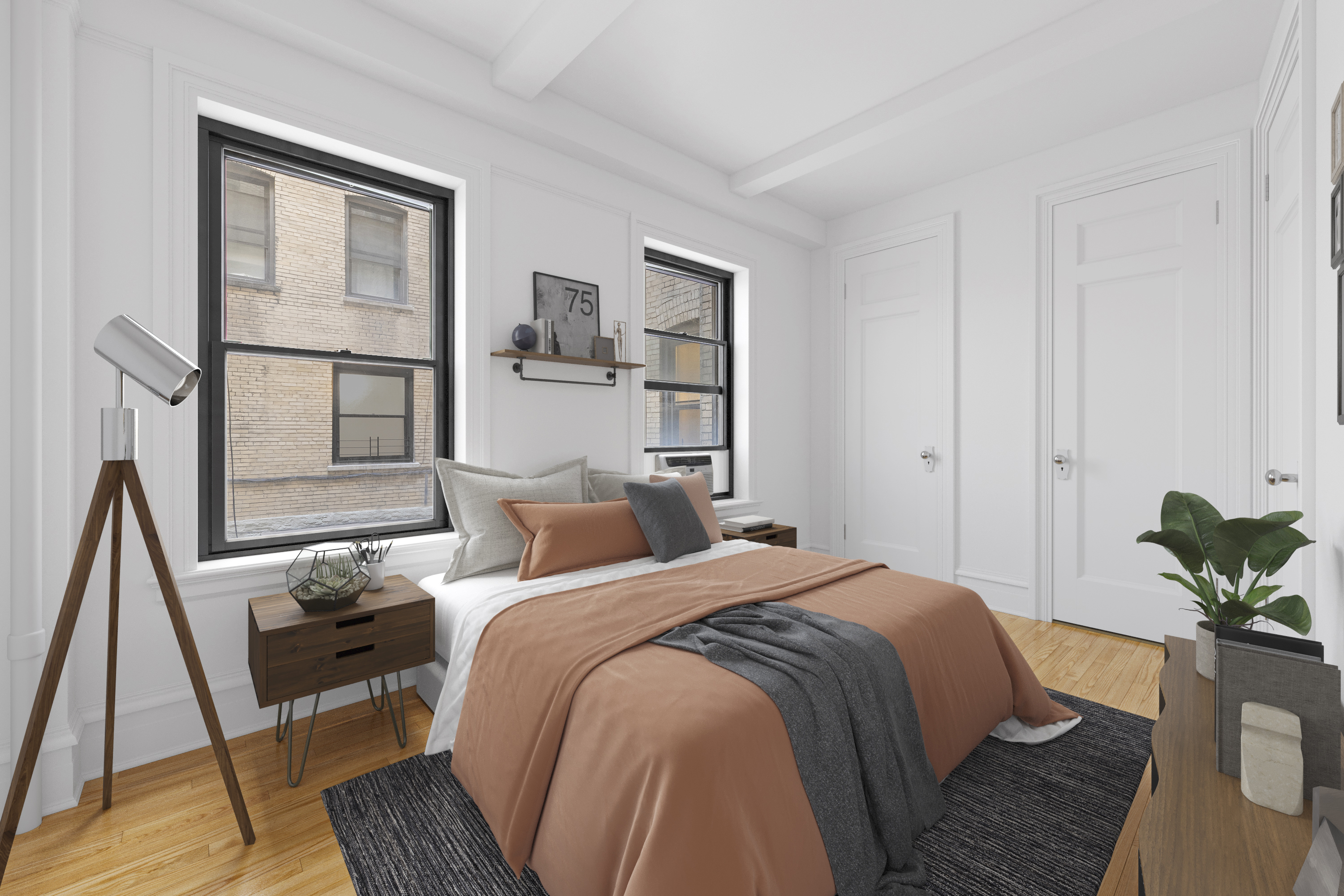 609 West 114th Street, Unit 2 Manhattan, NY 10025 - Photo 10 of 16 a bedroom with a bed a rug a potted plant and a window