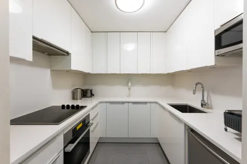 a view of cars parked in front of a building