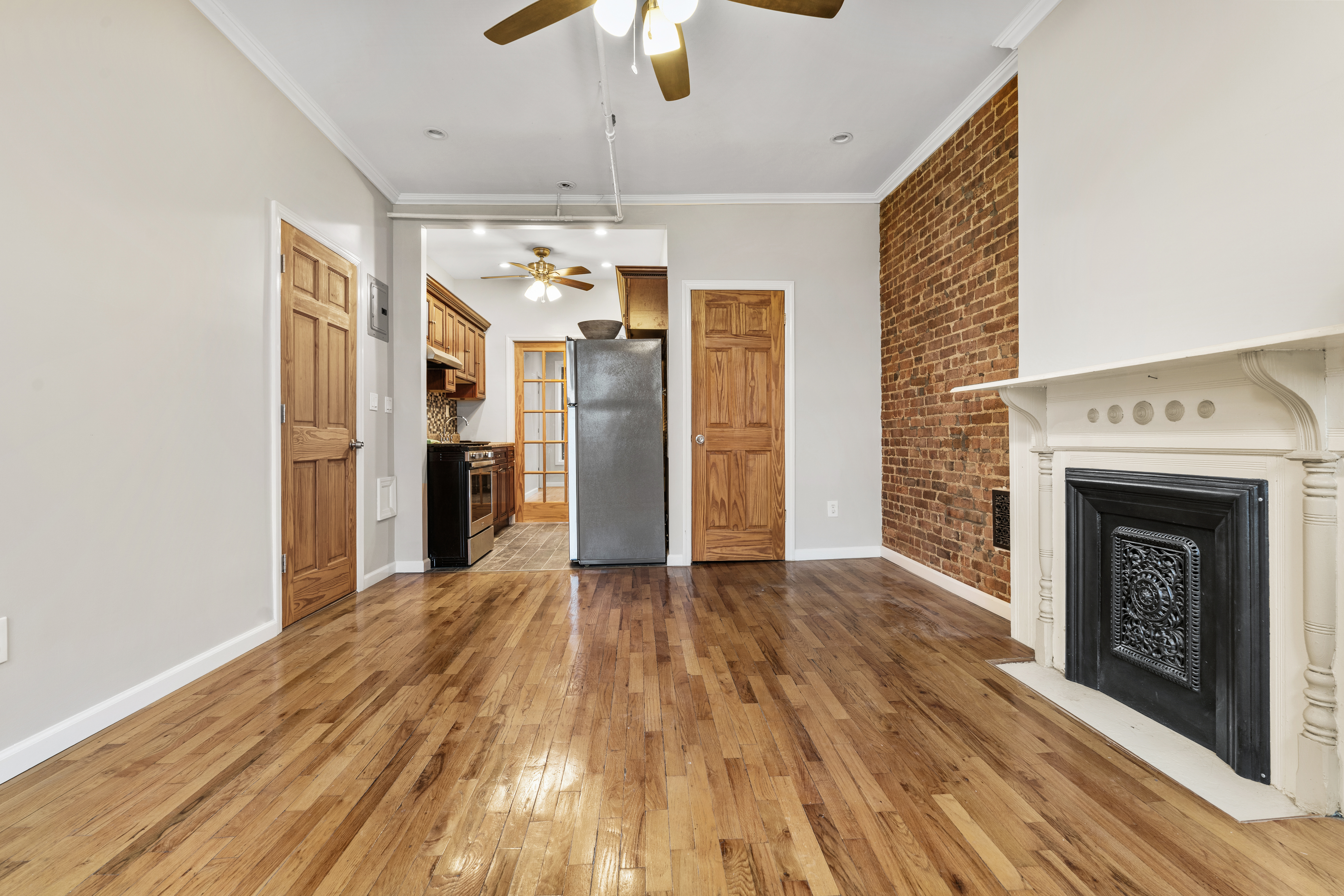 615 Putnam Avenue, Unit 4 Brooklyn, NY 11221 - Photo 3 of 10 a view of an empty room with a fireplace