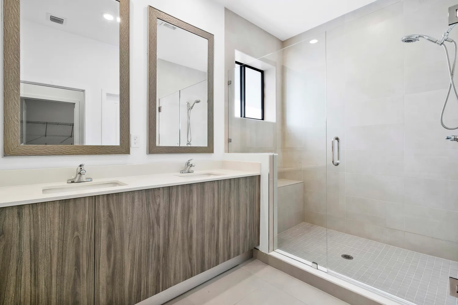 a bathroom with a shower sink and mirror