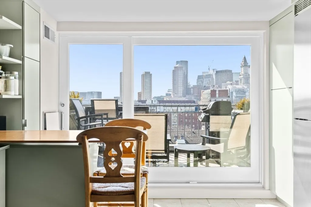 a living room with a fireplace furniture and a window