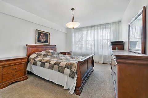 a bed room with a bed and a tv