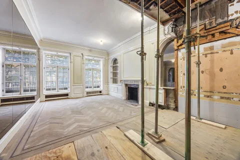 a view of a spacious bathroom with a tub and shower