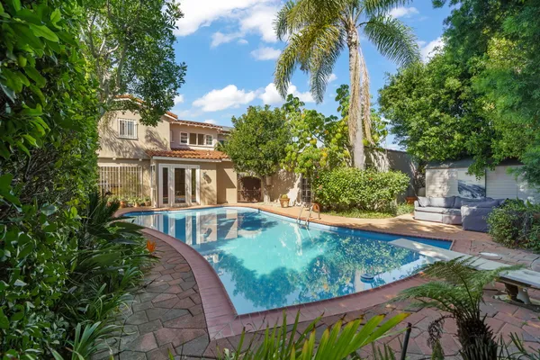 a view of a house with swimming pool