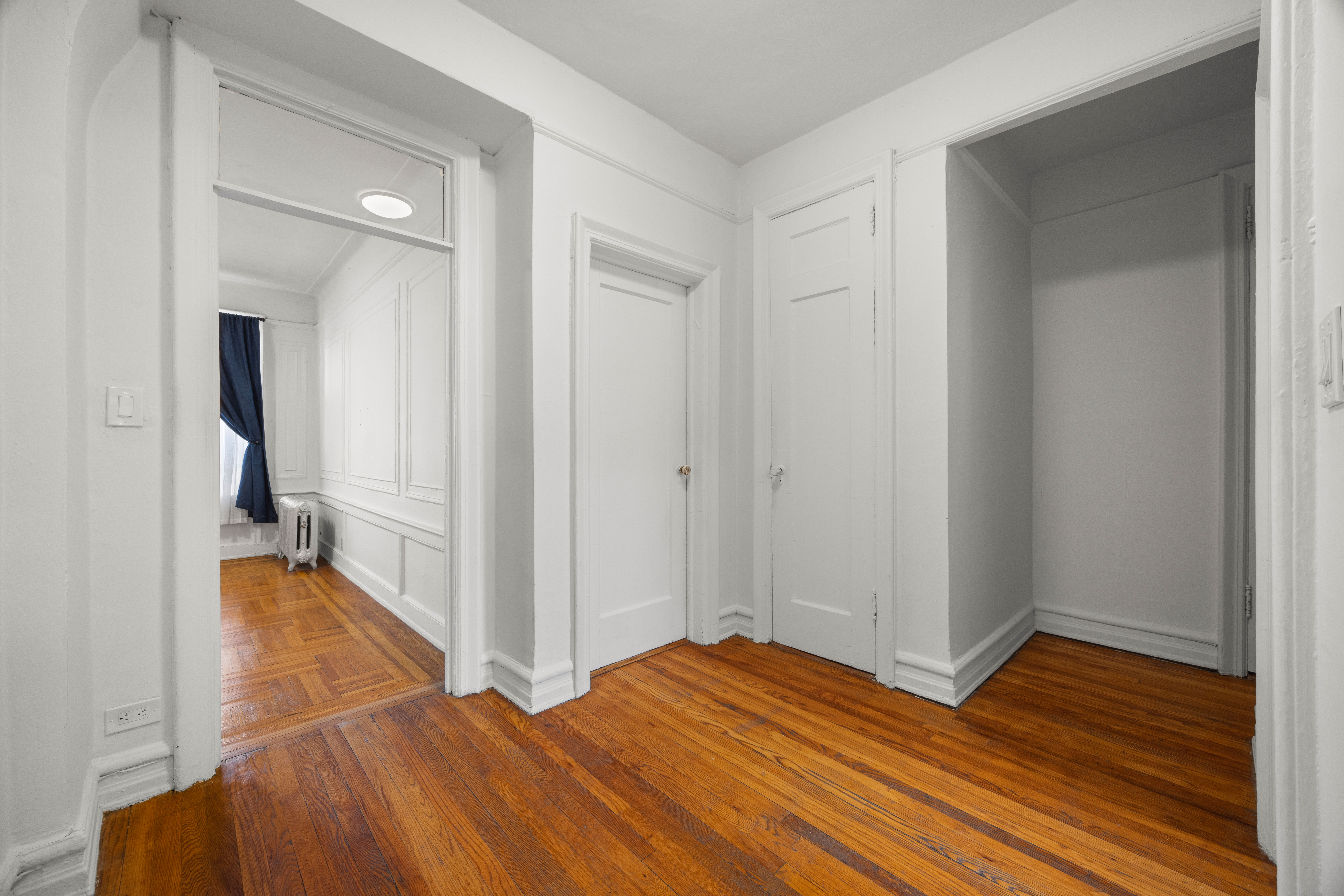 179 Ocean Parkway, Unit 4H Brooklyn, NY 11218 - Photo 3 of 11 wooden floor with view of bathroom