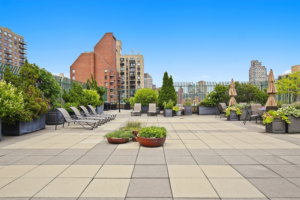 201 East 80th Street, Unit 16D Manhattan, NY 10075 - Photo 17 of 19 a view of a terrace with chairs