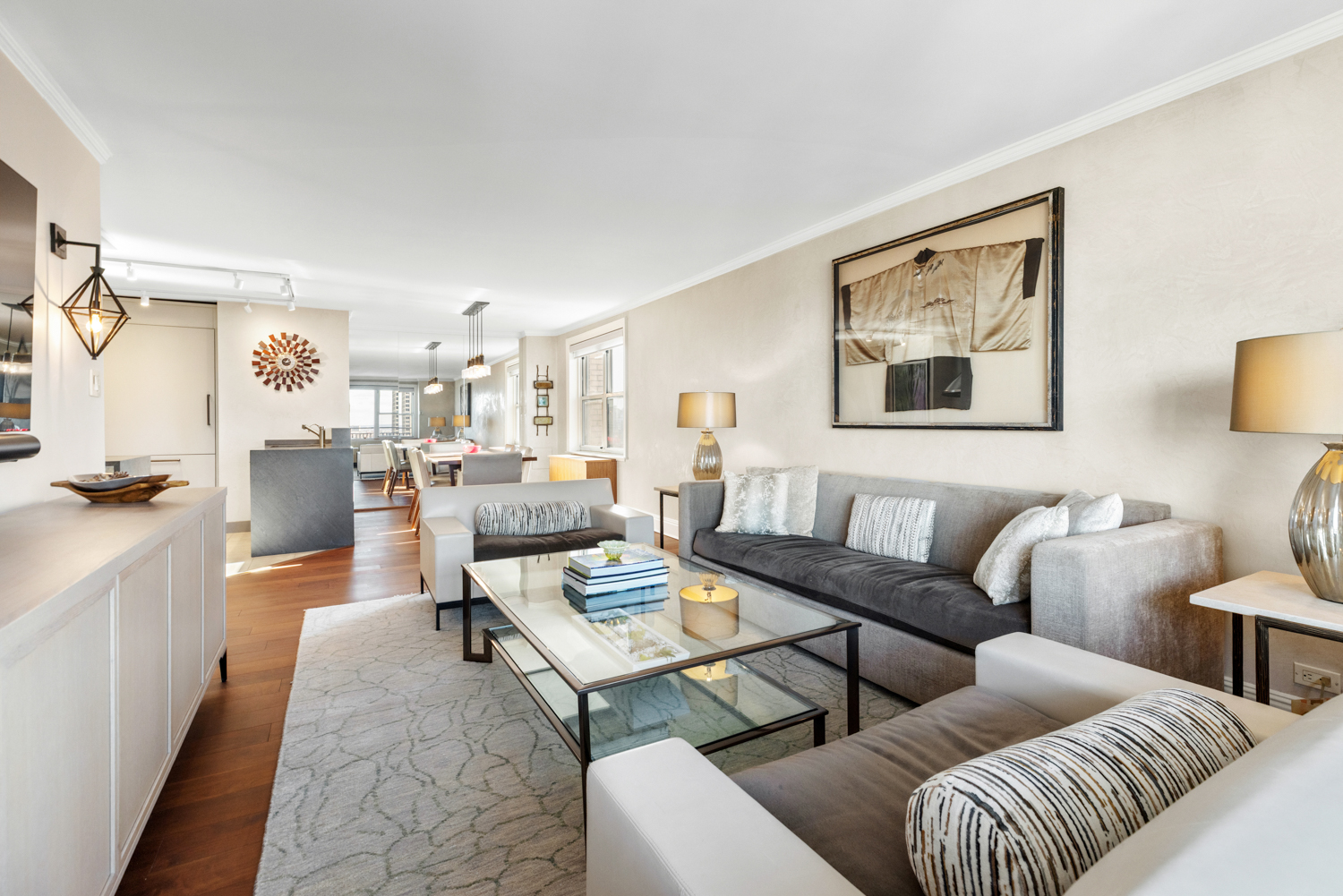 201 West 70th Street, Unit 29KL Manhattan, NY 10023 - Photo 7 of 20 a living room with furniture kitchen view and a window