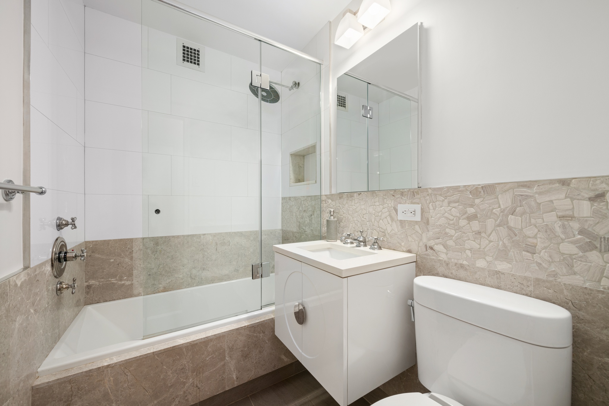 10 West 15th Street, Unit 1027/1028 Manhattan, NY 10011 - Photo 10 of 15 a bathroom with a sink a toilet and shower