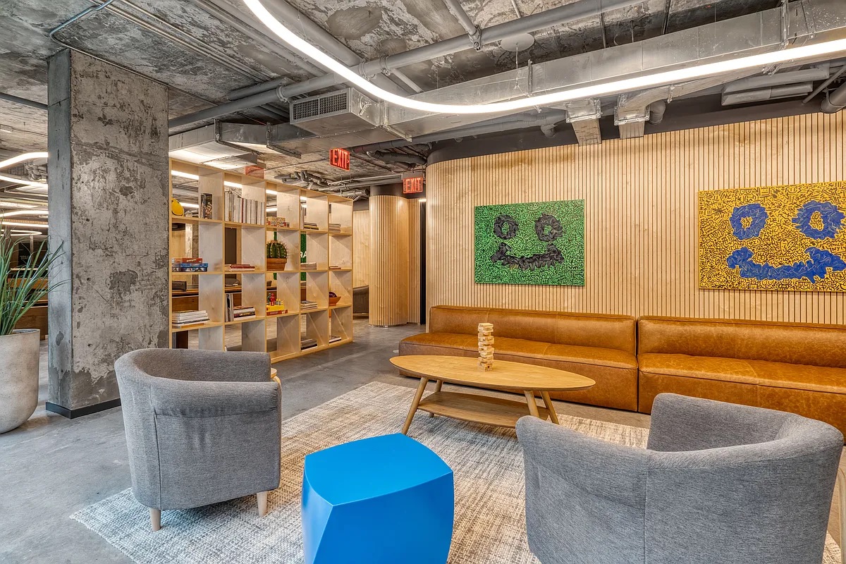 158 East 126th Street, Unit 730 Manhattan, NY 10035 - Photo 17 of 18 a living room with furniture and a black umbrella
