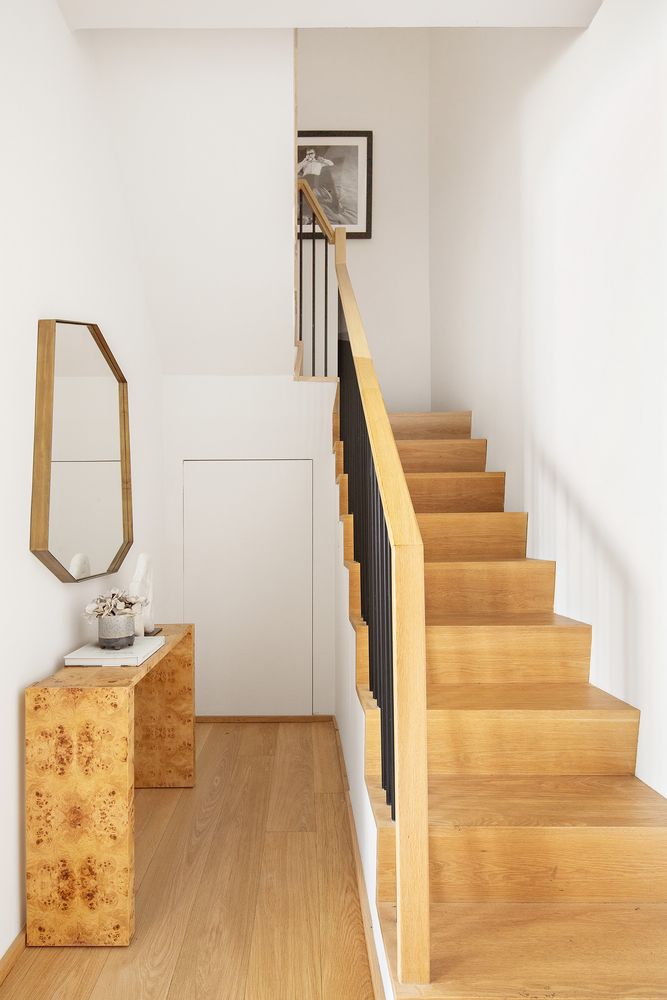 a view of entryway and hall with wooden floor
