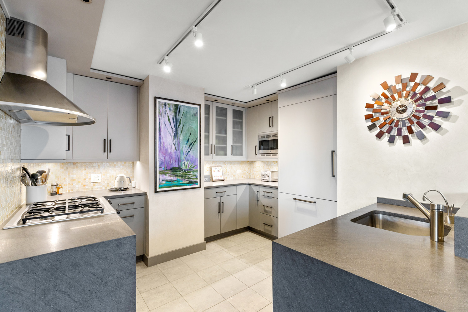 201 West 70th Street, Unit 29KL Manhattan, NY 10023 - Photo 3 of 20 a kitchen with a sink stove and refrigerator