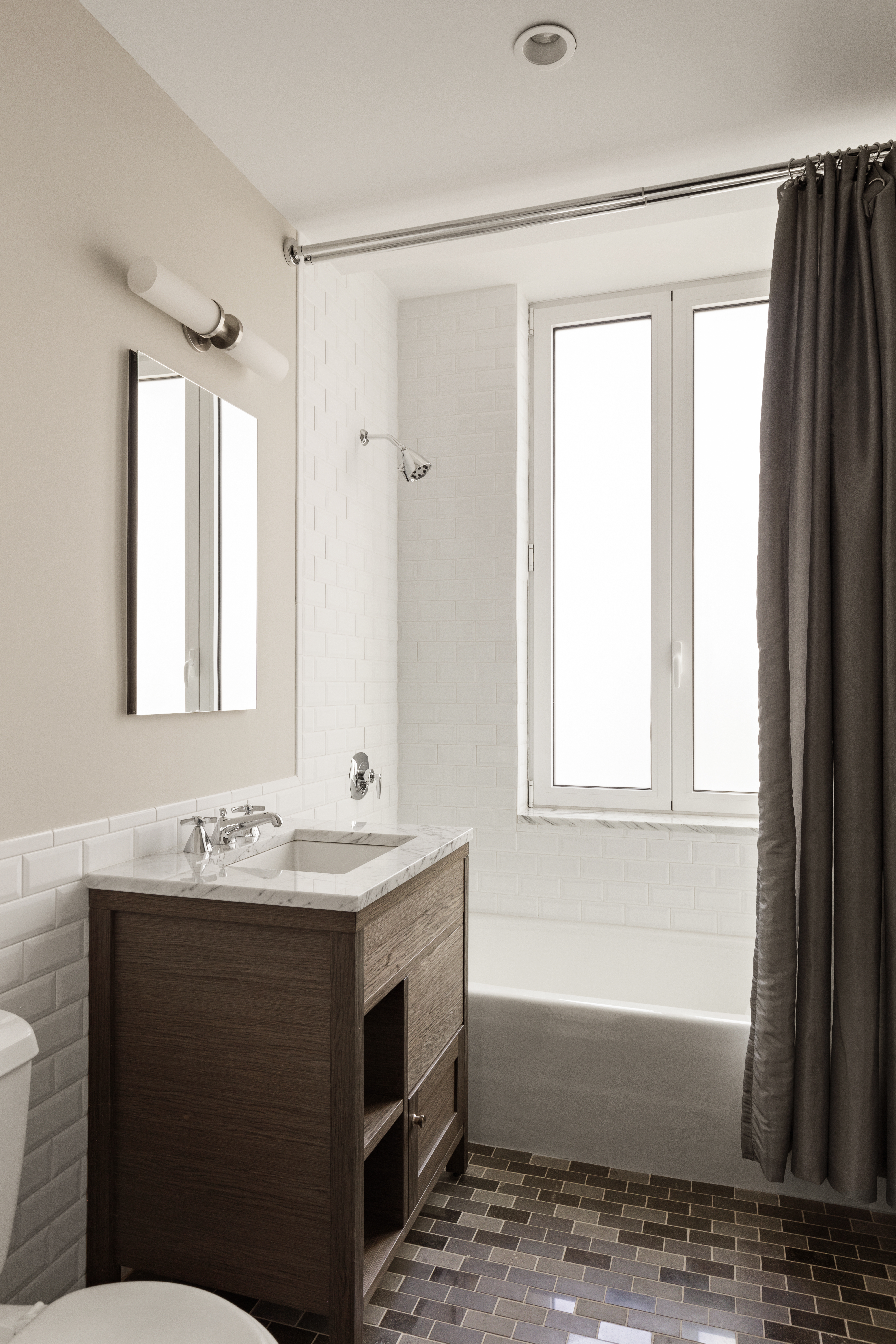 230 West 78th Street, Unit 18A Manhattan, NY 10024 - Photo 9 of 14 a bathroom with a sink and a mirror