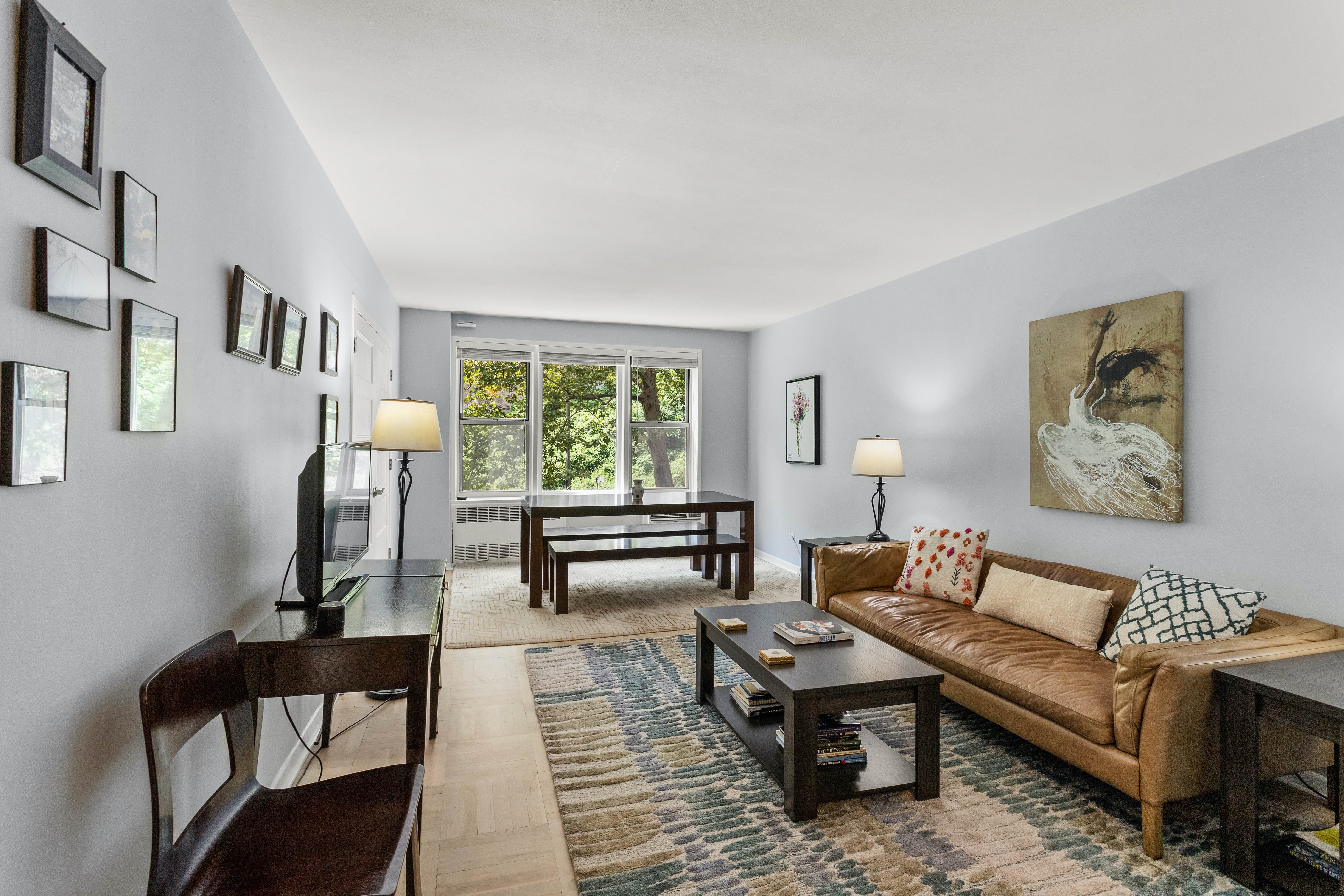 a living room with furniture and a window