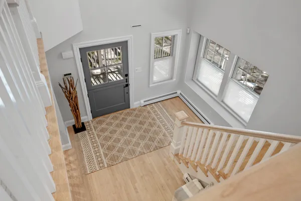 a view of entryway with wooden floor