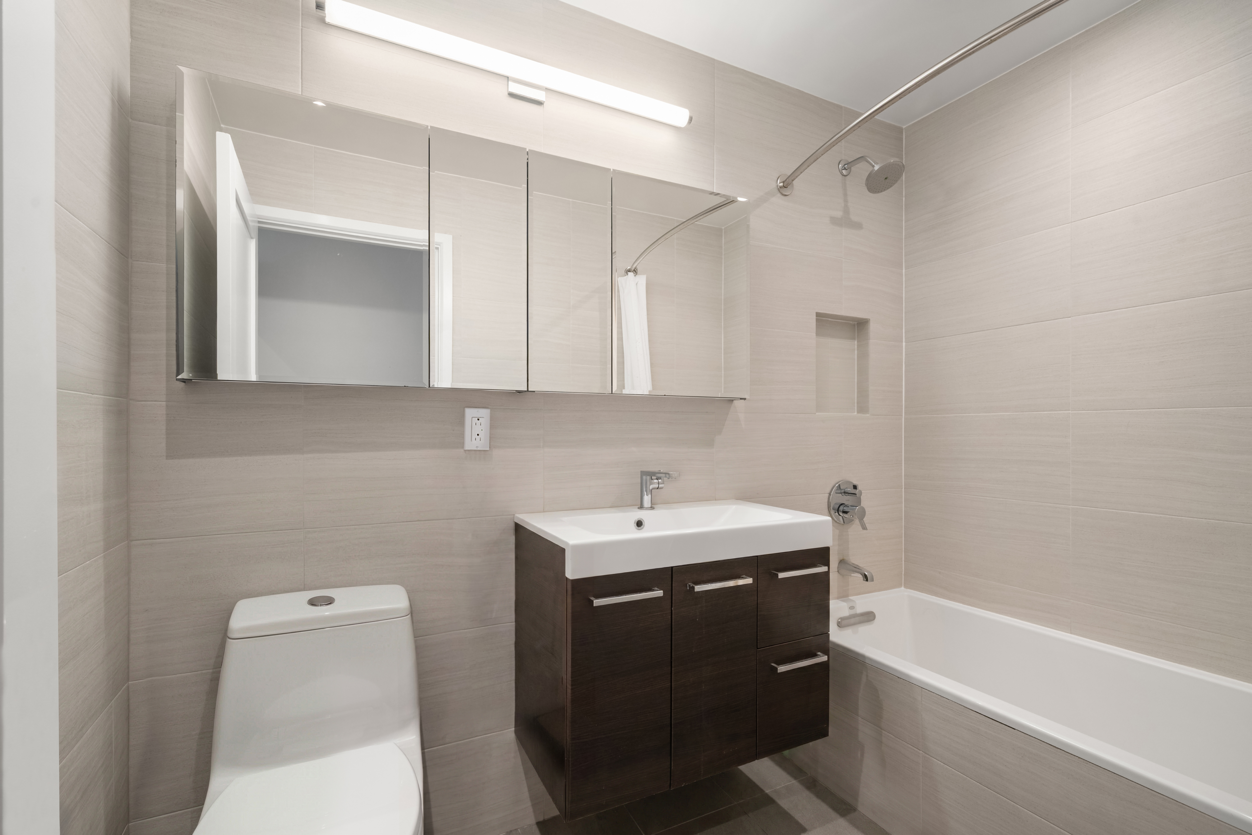 407 East 12th Street, Unit 3FE Manhattan, NY 10009 - Photo 9 of 11 a bathroom with a sink a toilet and bathtub