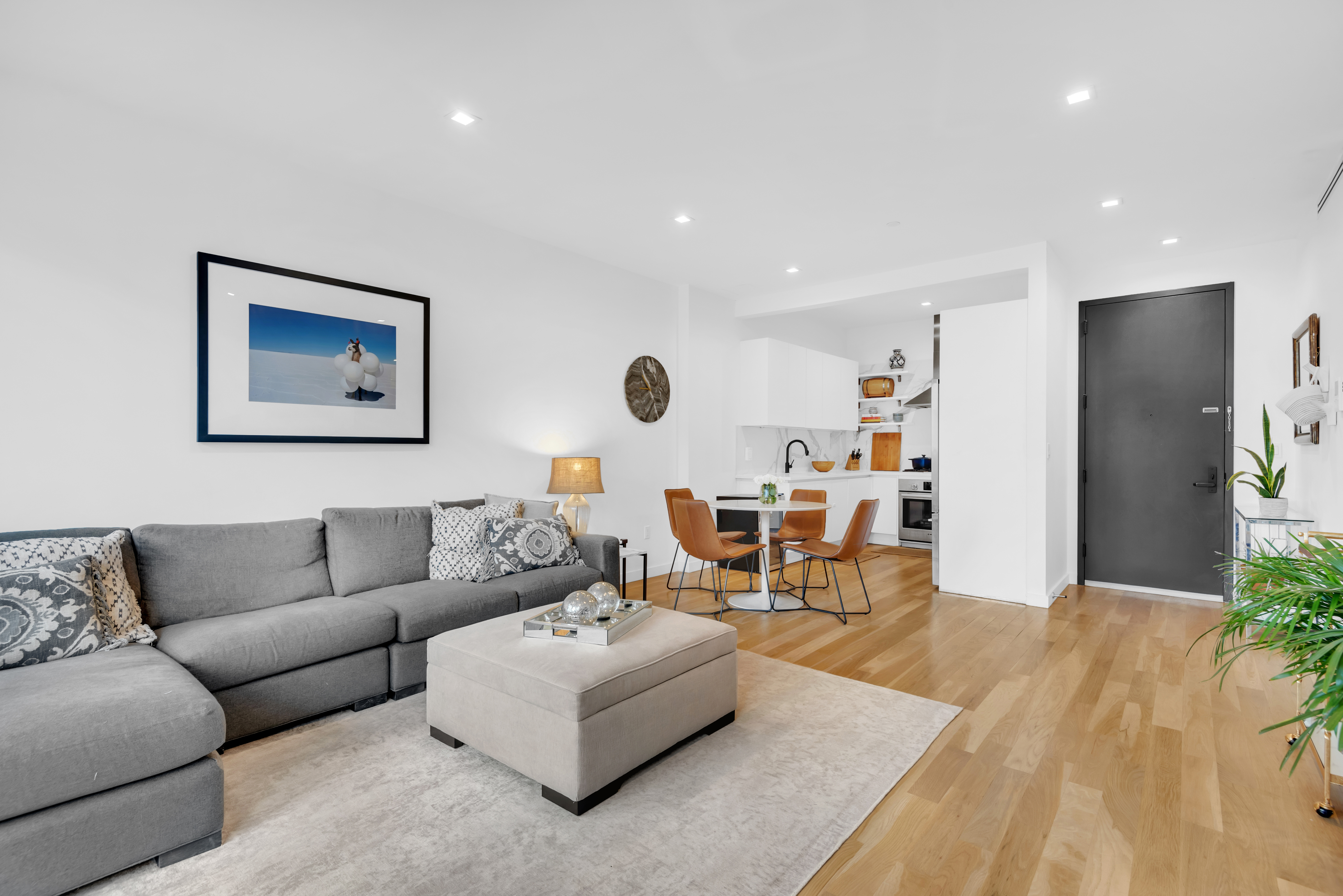 267 Evergreen Avenue, Unit 3A Brooklyn, NY 11221 - Photo 2 of 16 a living room with furniture and a large window