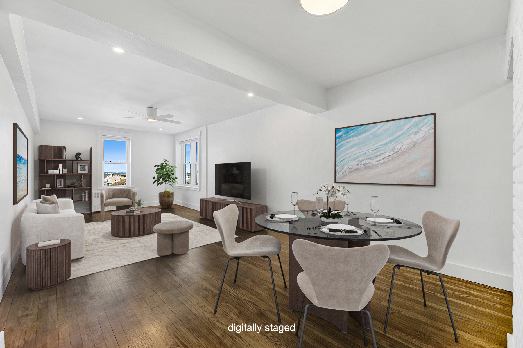 a living room with furniture kitchen view and a flat screen tv