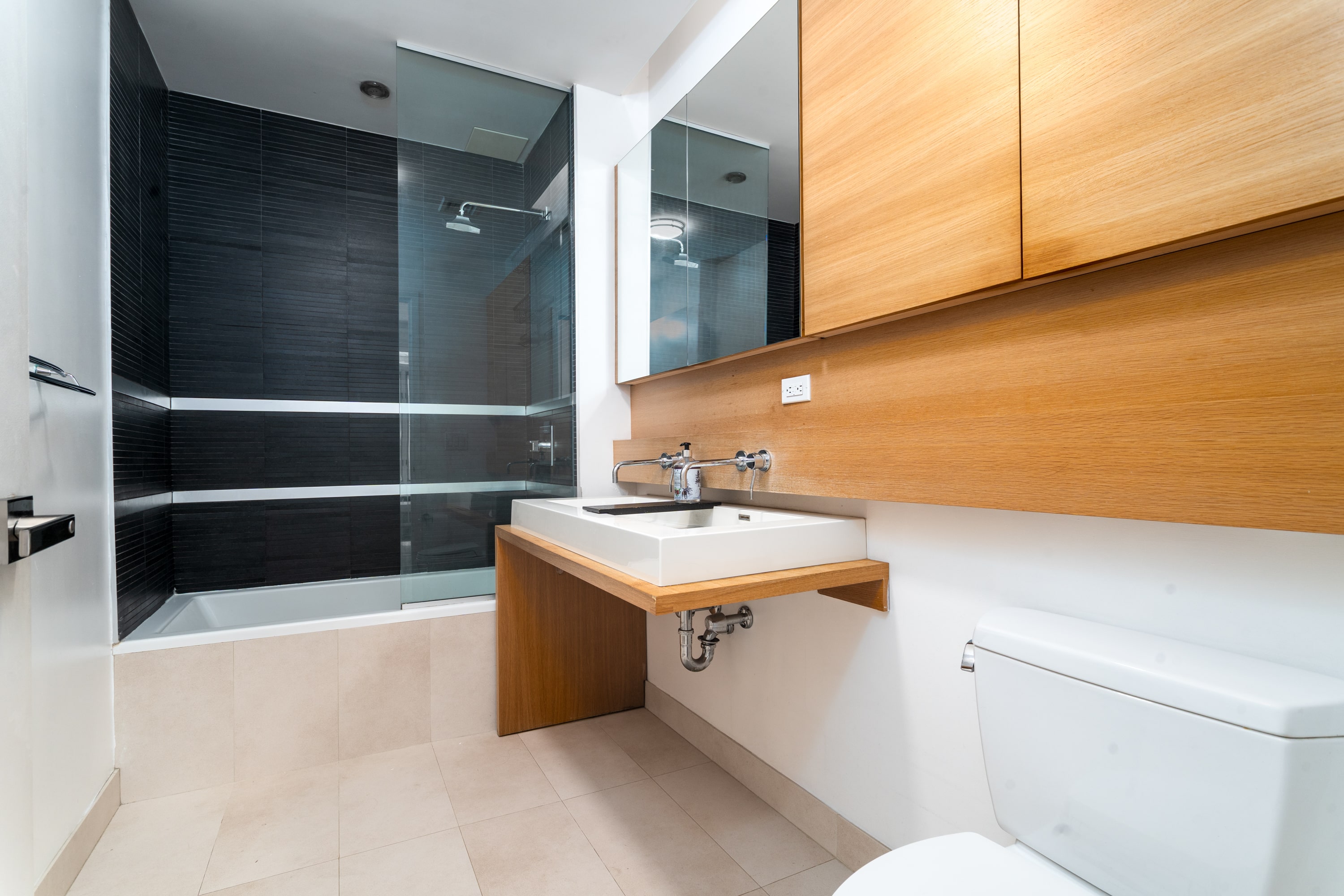 342 East 110th Street, Unit 3D Manhattan, NY 10029 - Photo 11 of 15 a bathroom with a sink and mirror