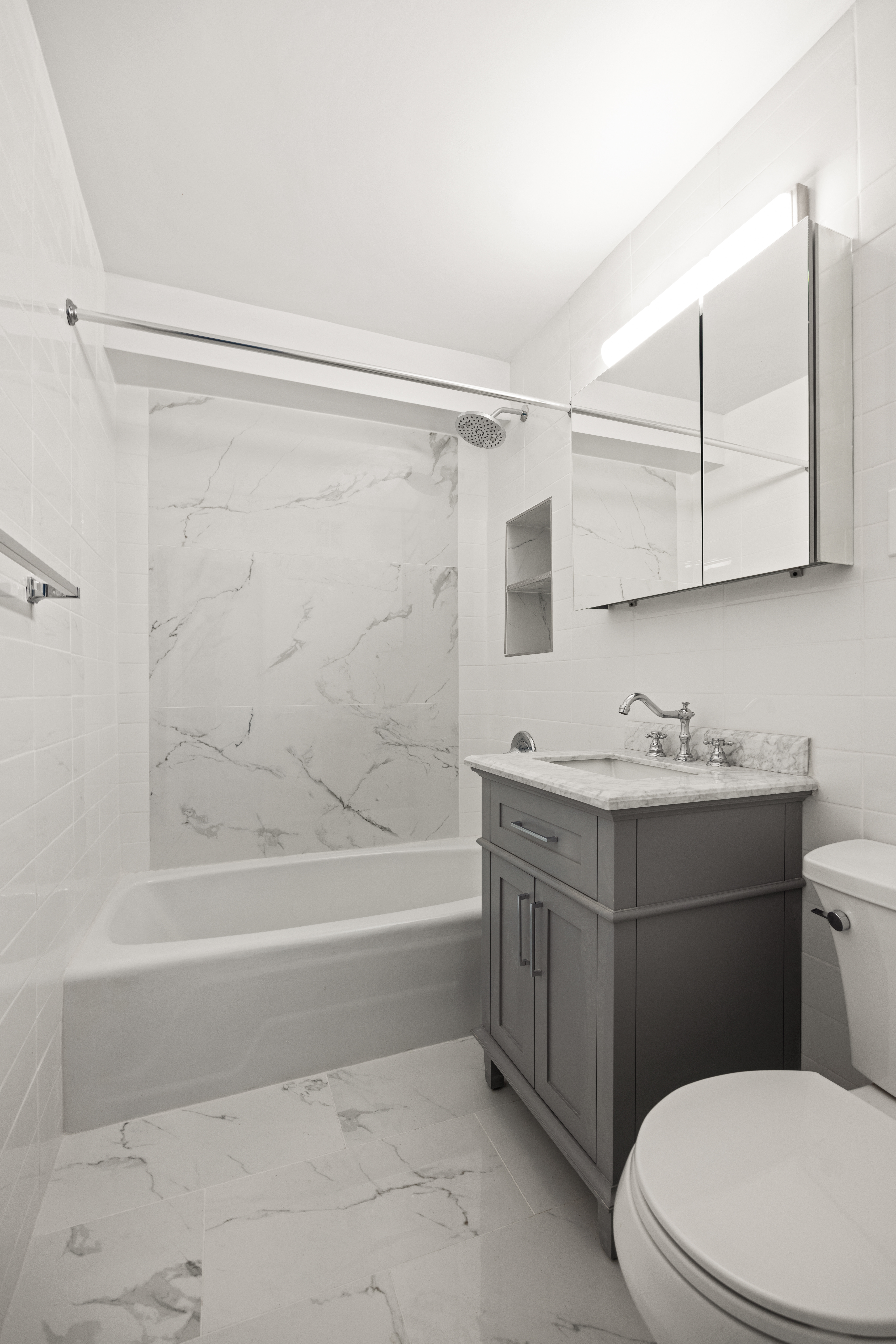 135 Ocean Parkway, Unit 9M Brooklyn, NY 11218 - Photo 11 of 18 a bathroom with a sink a toilet and shower