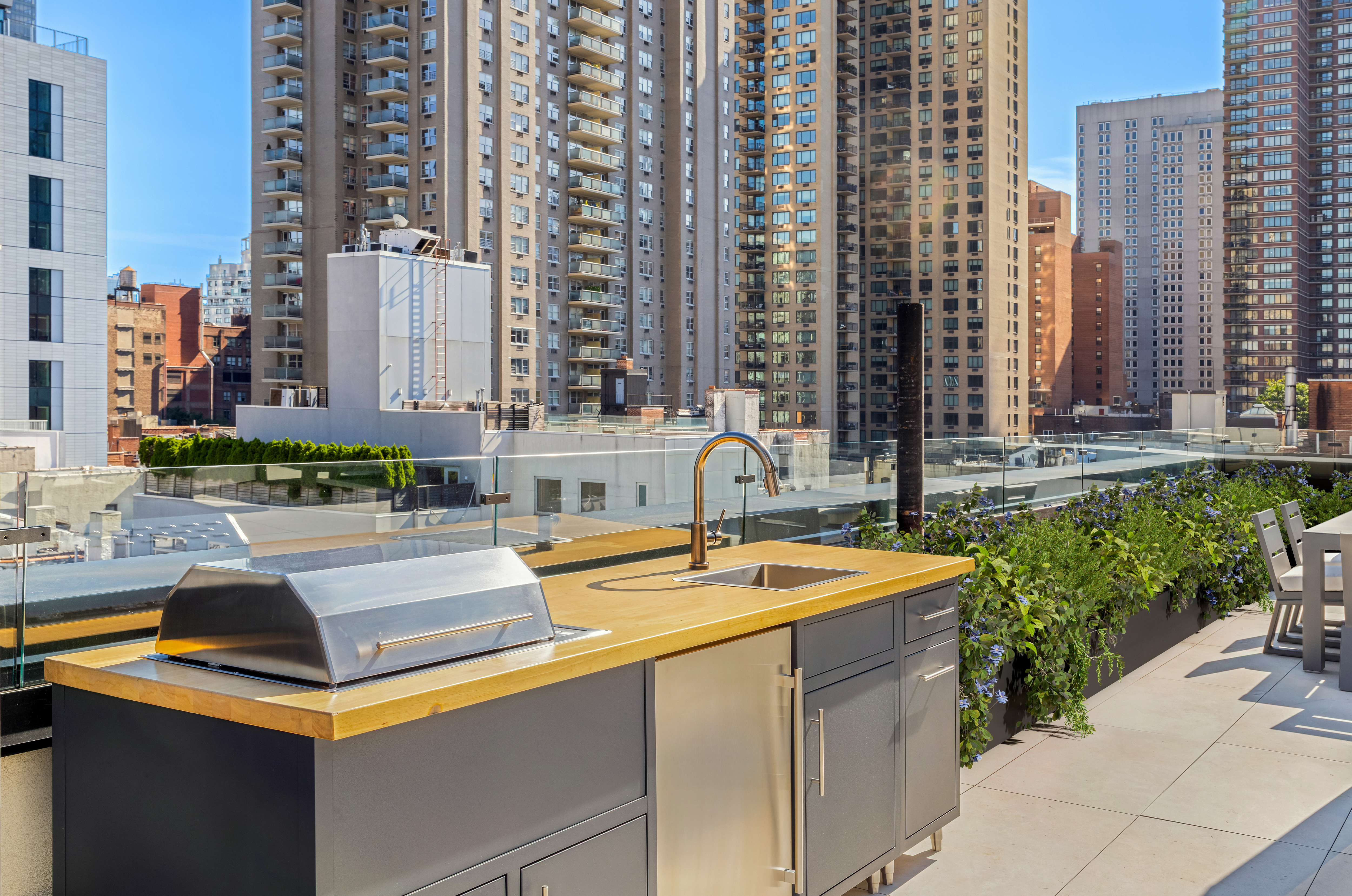 420 East 75th Street, Unit 2 Manhattan, NY 10021 - Photo 23 of 25 a swimming pool with outdoor seating and yard