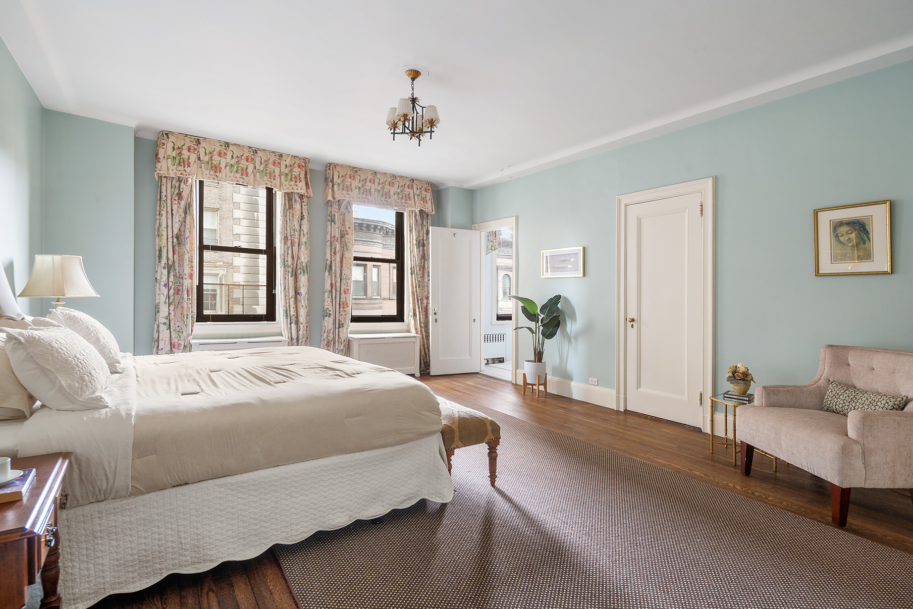 1115 5th Avenue, Unit 5B Manhattan, NY 10128 - Photo 6 of 19 a living room with a bed furniture and a window