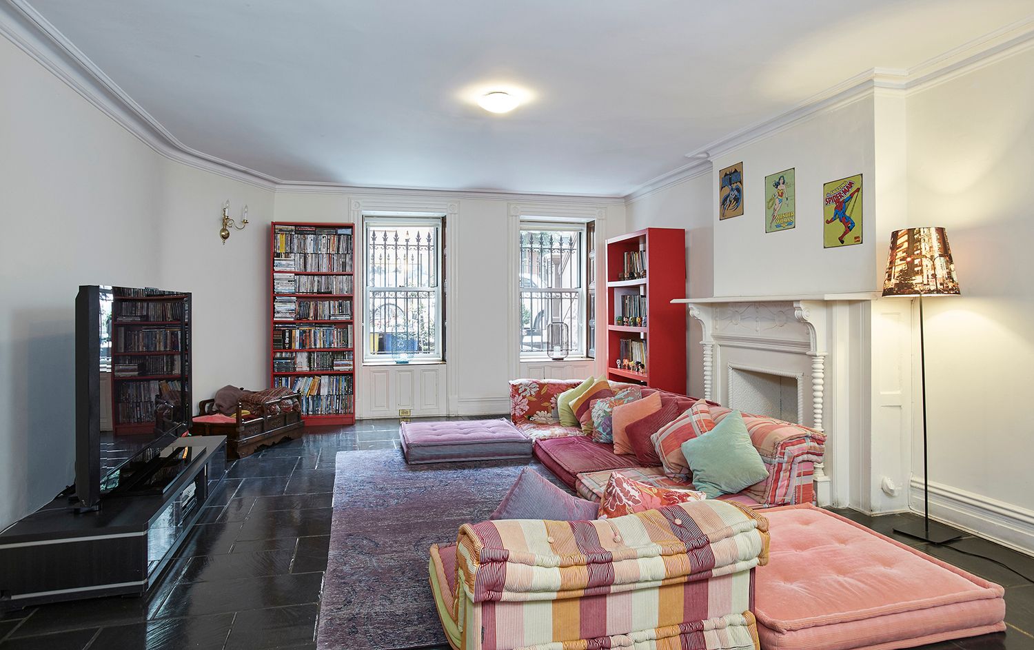 143 West 78th Street Manhattan, NY 10024 - Photo 8 of 17 a living room with furniture a flat screen tv and a fireplace