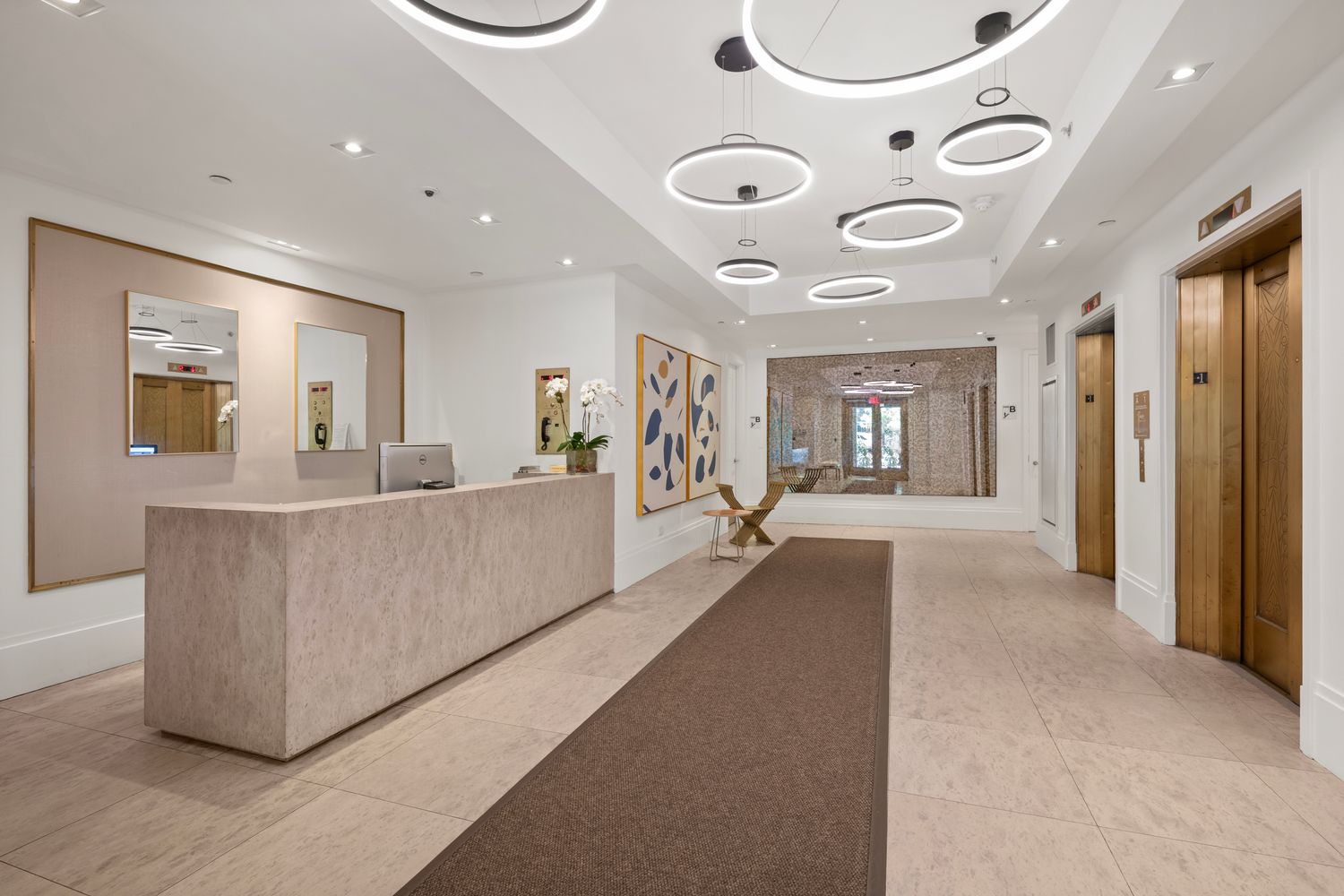 101 Wall Street, Unit 5BE Manhattan, NY 10005 - Photo 10 of 16 a living room with furniture and a large window