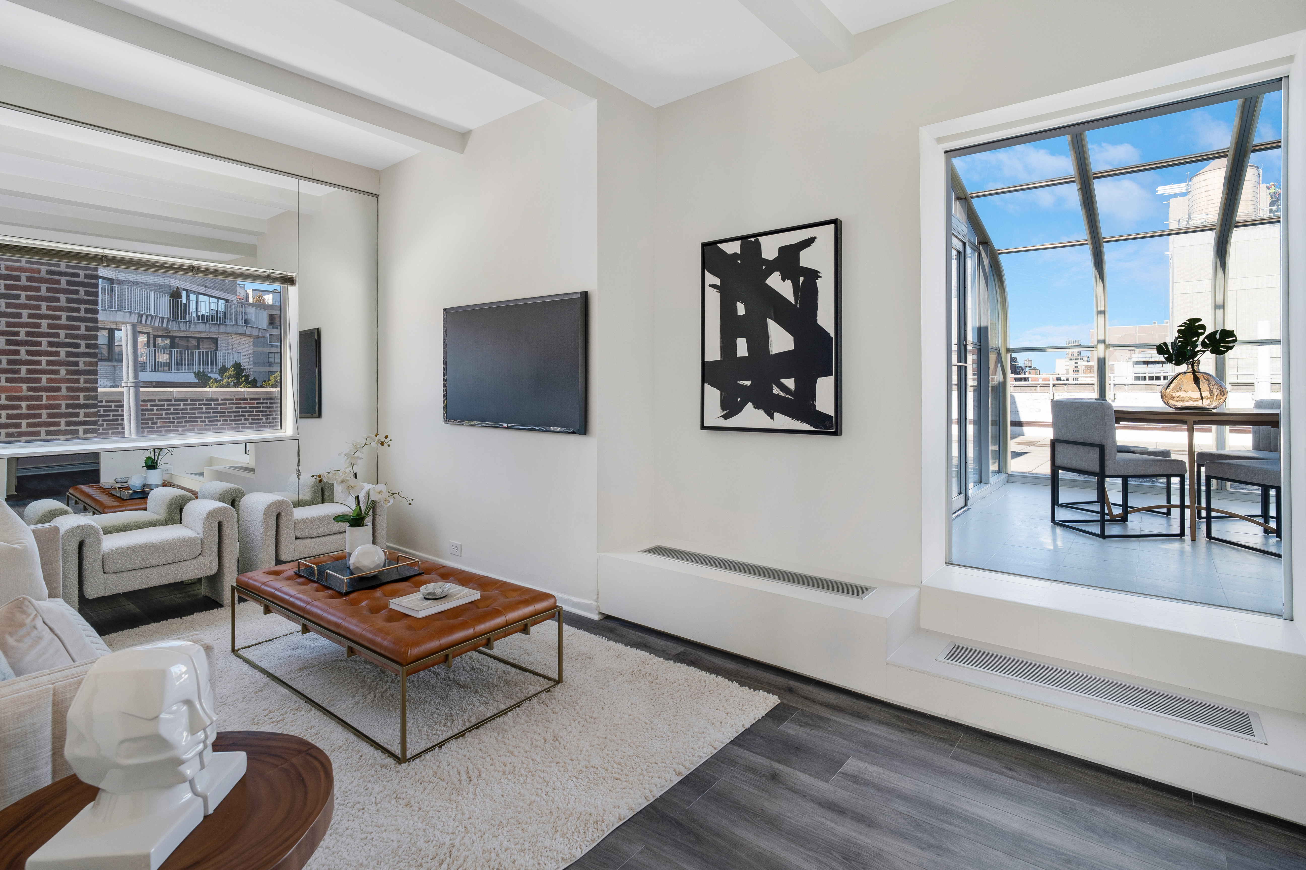 1349 Lexington Avenue, Unit PH2 Manhattan, NY 10128 - Photo 3 of 18 a living room with furniture and a flat screen tv