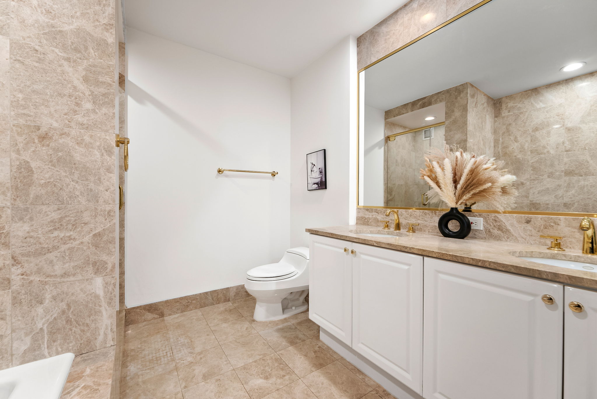 220 Riverside Boulevard, Unit 4M Manhattan, NY 10069 - Photo 7 of 11 a bathroom with a sink a toilet and a mirror