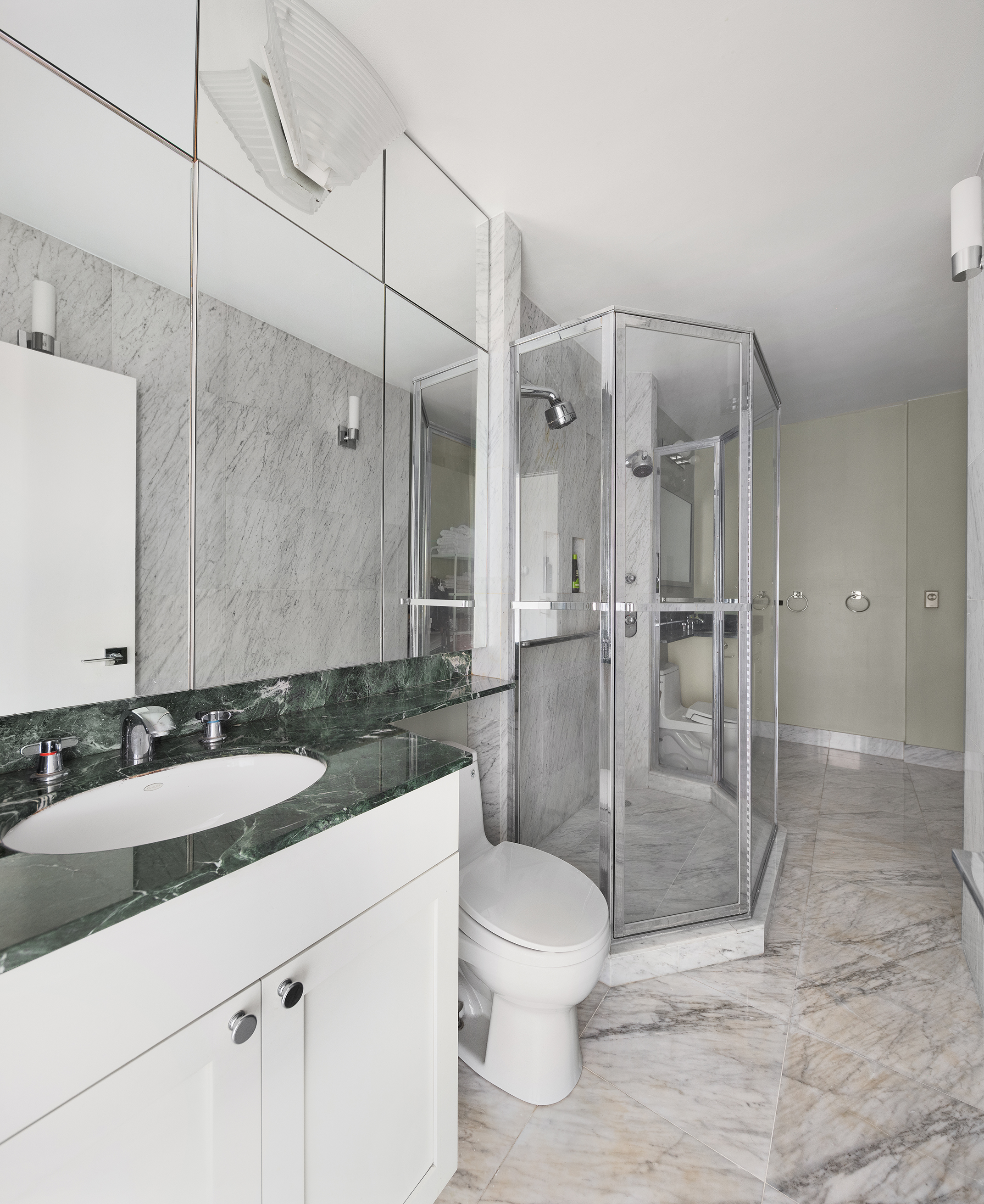 111 East 30th Street, Unit 16C Manhattan, NY 10016 - Photo 10 of 13 a bathroom with a sink toilet and shower