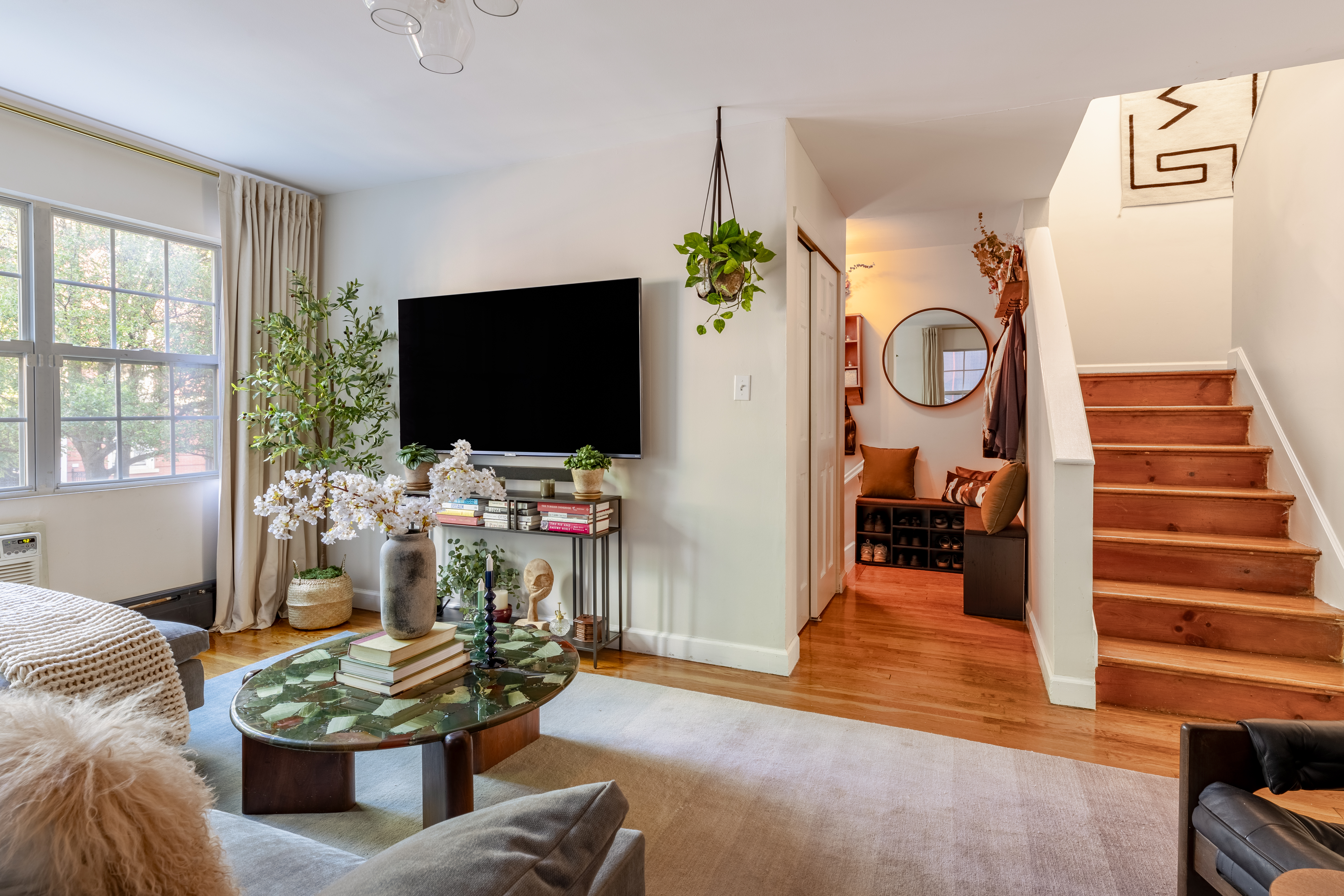 80 South 3rd Street, Unit 2 Brooklyn, NY 11249 - Photo 2 of 15 a living room with furniture a flat screen tv and a fireplace