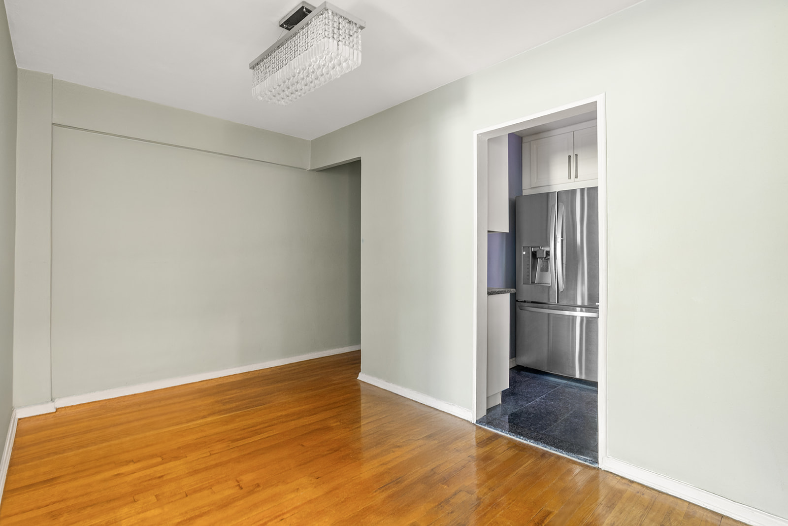 33-15 81st Street, Unit 4H Queens, NY 11372 - Photo 2 of 12 a view of a room with wooden floor and a hallway
