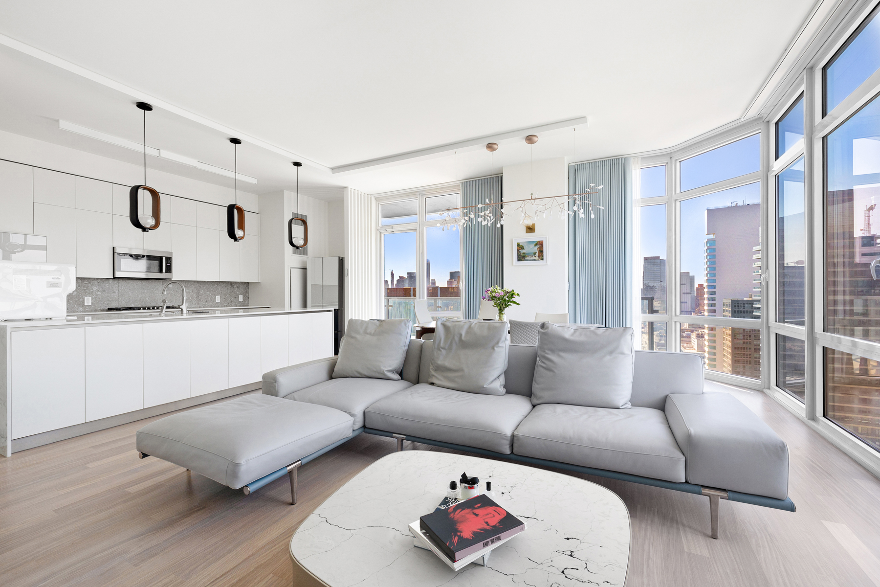 10 West End Avenue, Unit 30C Manhattan, NY 10023 - Photo 3 of 22 a living room with furniture and a large window