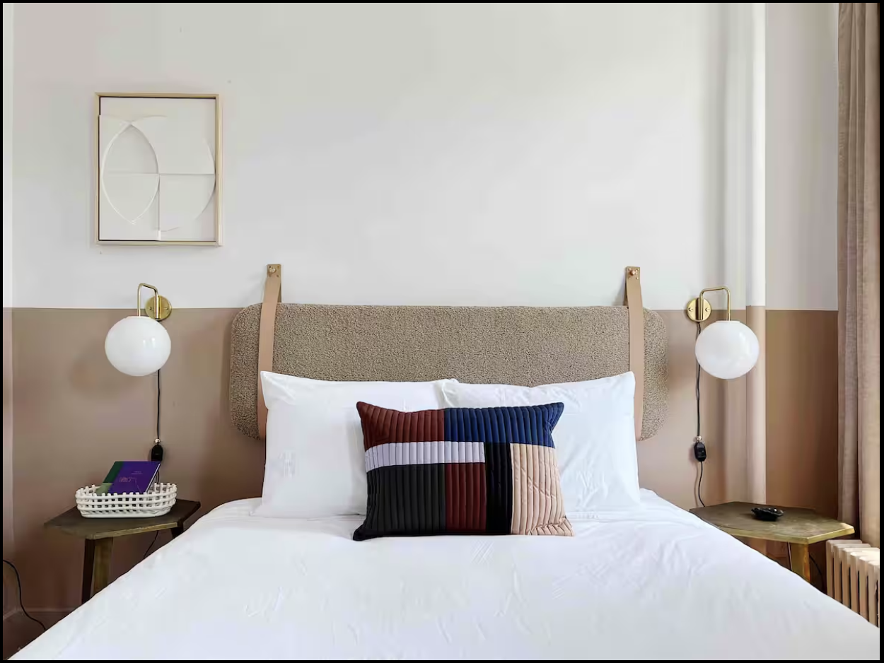 9 Spring Street, Unit 23 Manhattan, NY 10012 - Photo 3 of 7 a bedroom with a bed and wooden floor