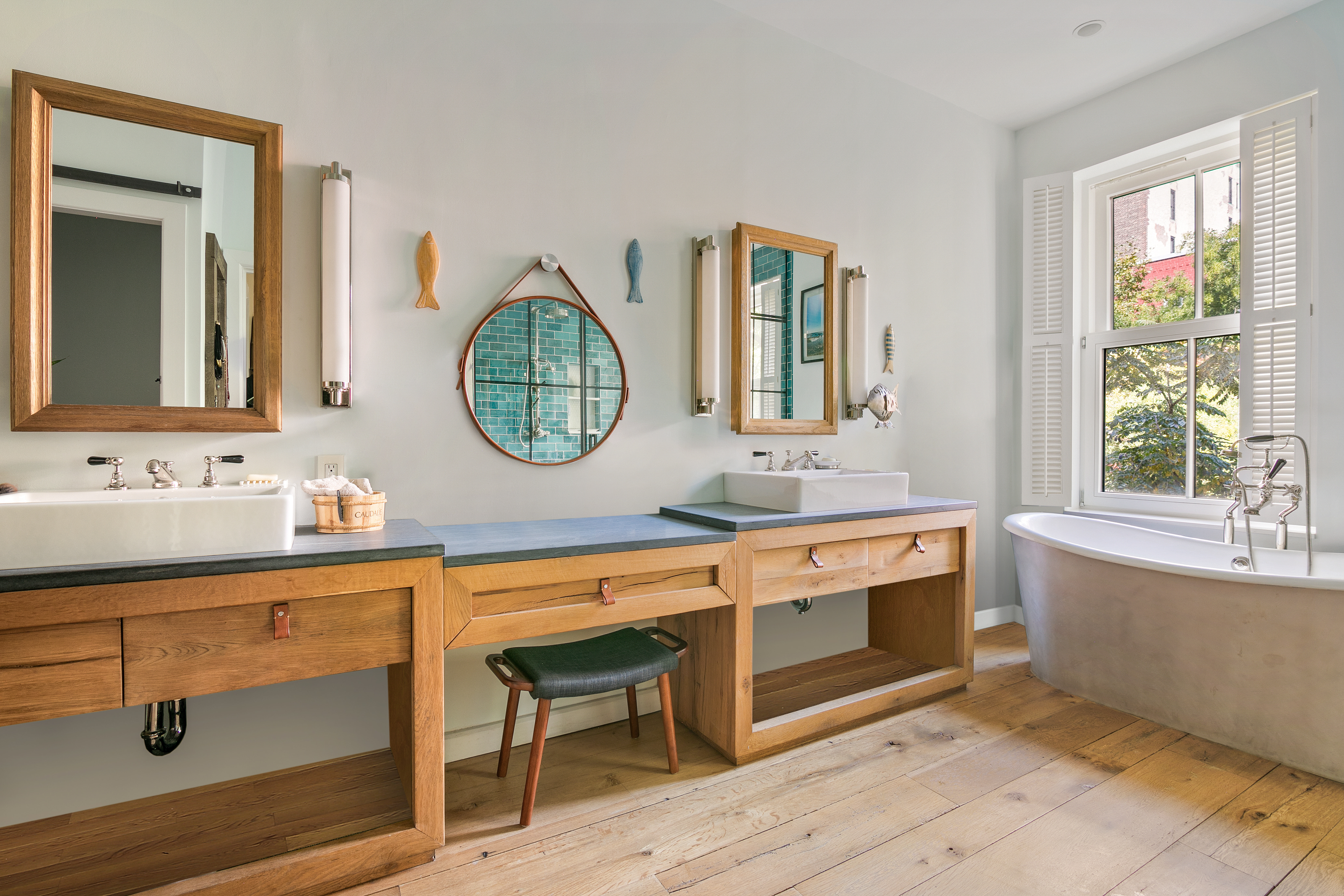 152 West 13th Street Manhattan, NY 10011 - Photo 17 of 28 a bathroom with a double vanity sink a mirror and a window