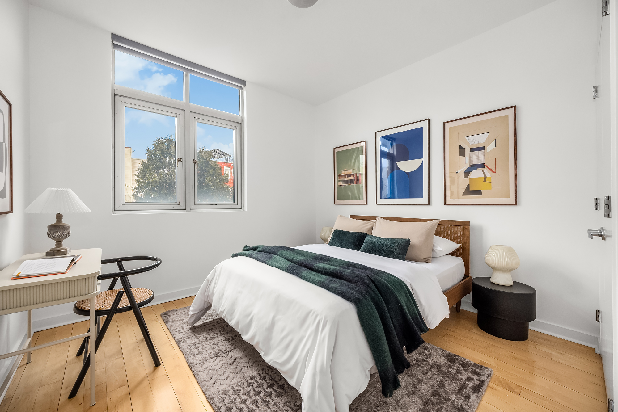 82 Guernsey Street, Unit 2A Brooklyn, NY 11222 - Photo 11 of 16 a bedroom with a bed and a painting on the wall