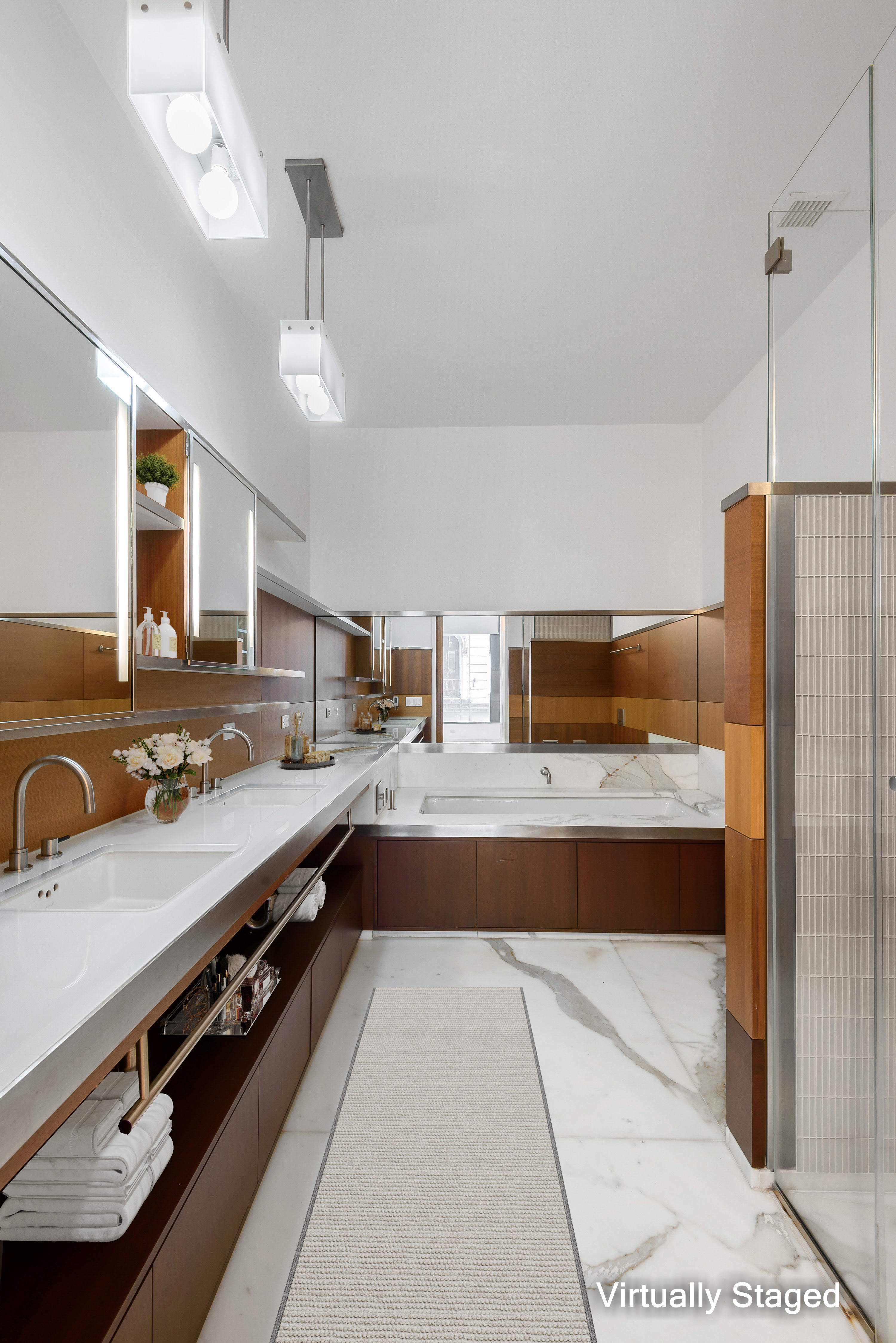 40 Mercer Street, Unit 19 Manhattan, NY 10013 - Photo 5 of 16 a large kitchen with kitchen island a stove a sink and a refrigerator