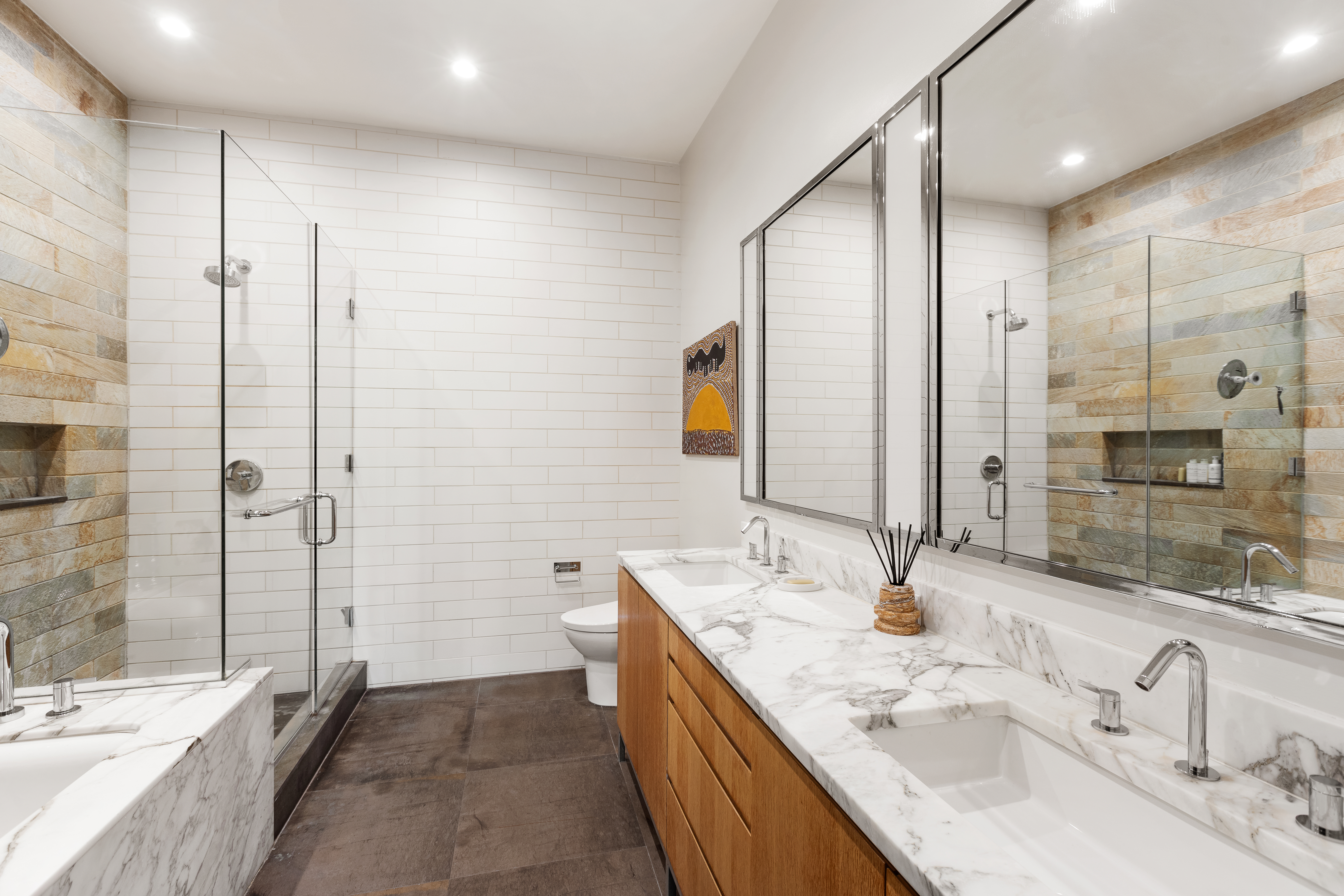 263 9th Avenue, Unit 2E Manhattan, NY 10001 - Photo 5 of 12 a bathroom with a double vanity sink mirror double and shower