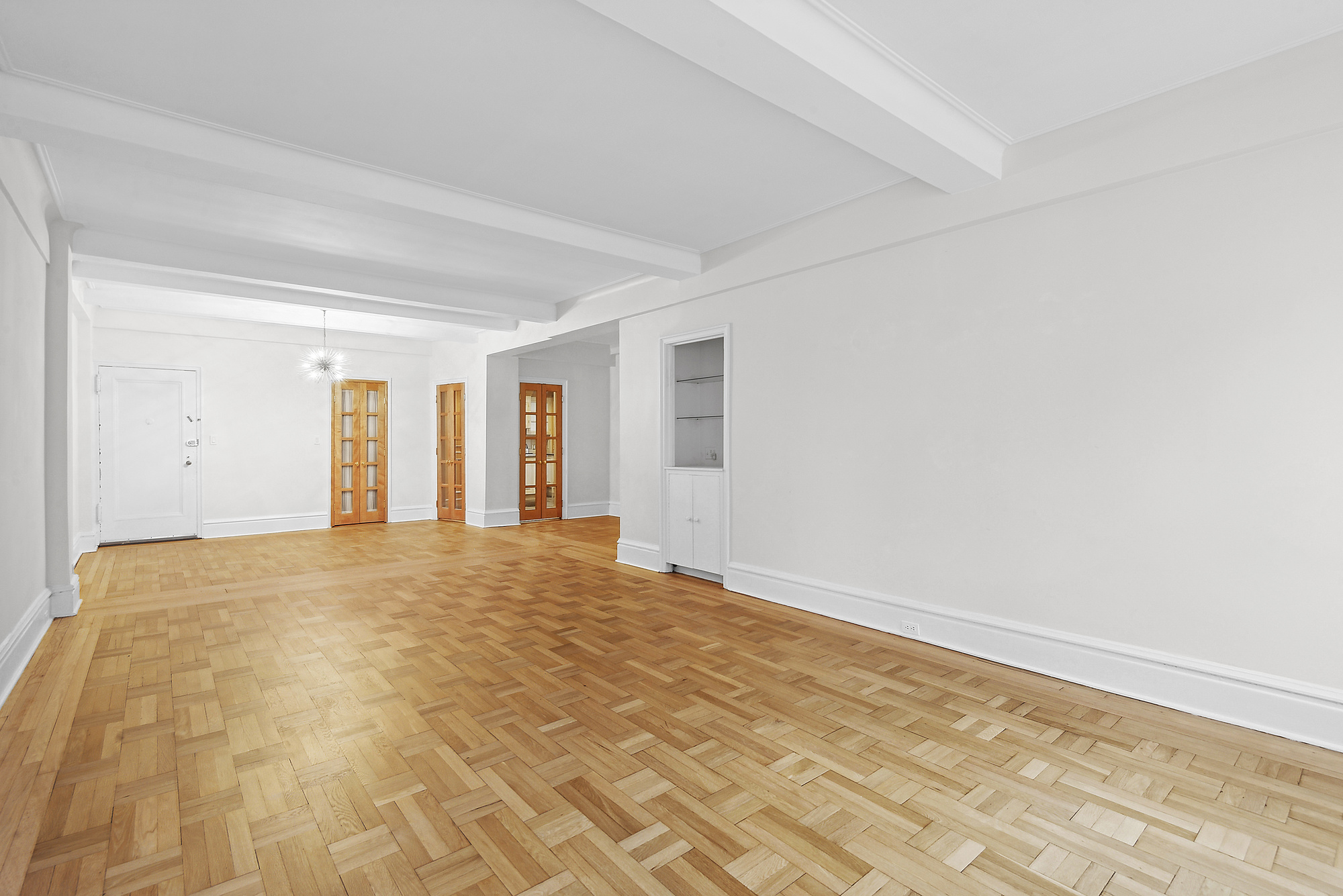 145 West 86th Street, Unit 12B Manhattan, NY 10024 - Photo 3 of 12 a view of empty room with wooden floor